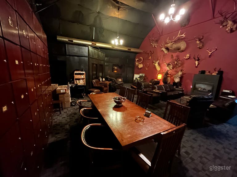  700 sq ft VIP speakeasy cigar lounge, 10 person dining table, sofas, easy chairs, fireplace, Hunting trophy wall 
