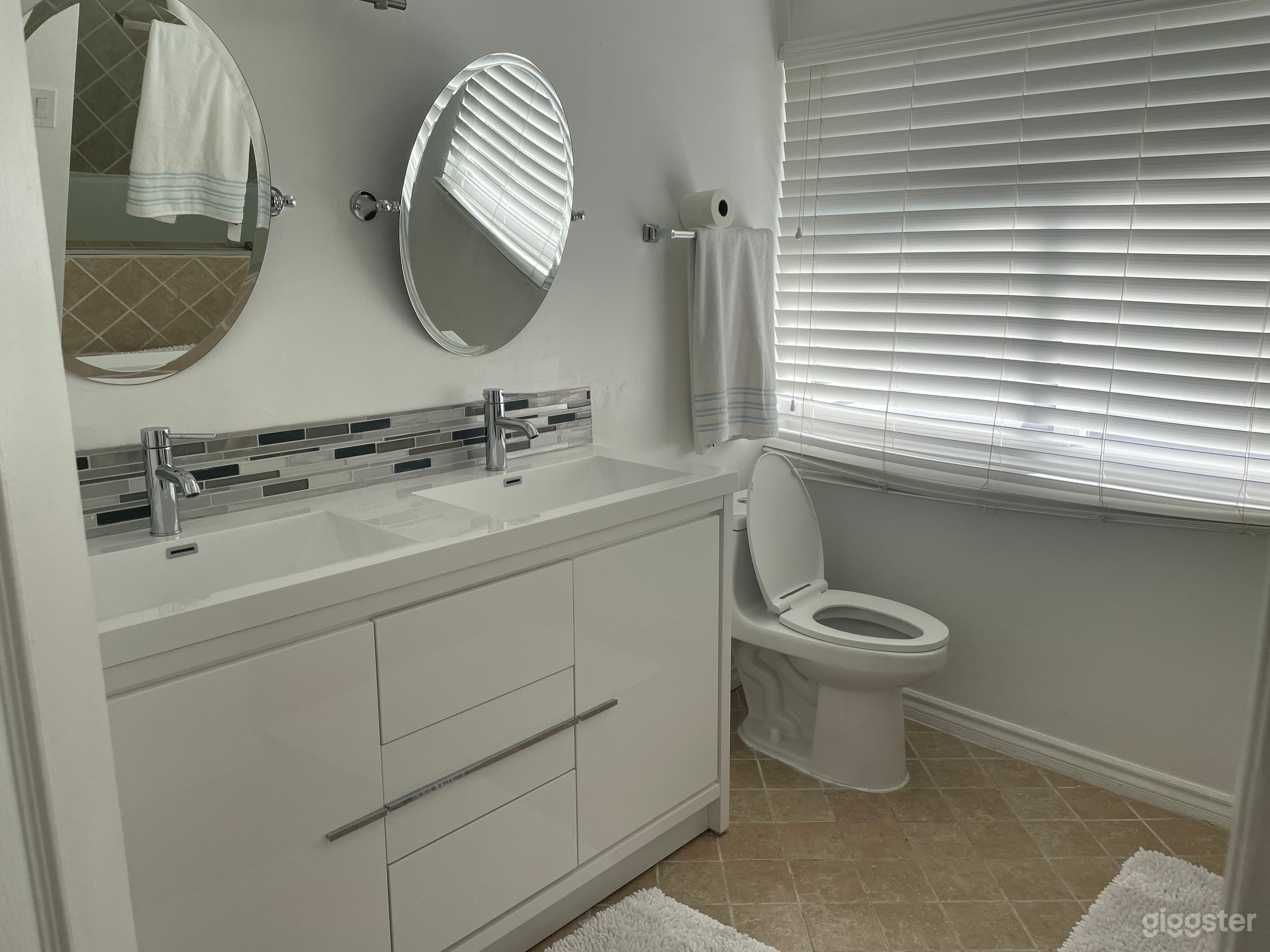 Upstairs bathroom. Connects to balcony.
