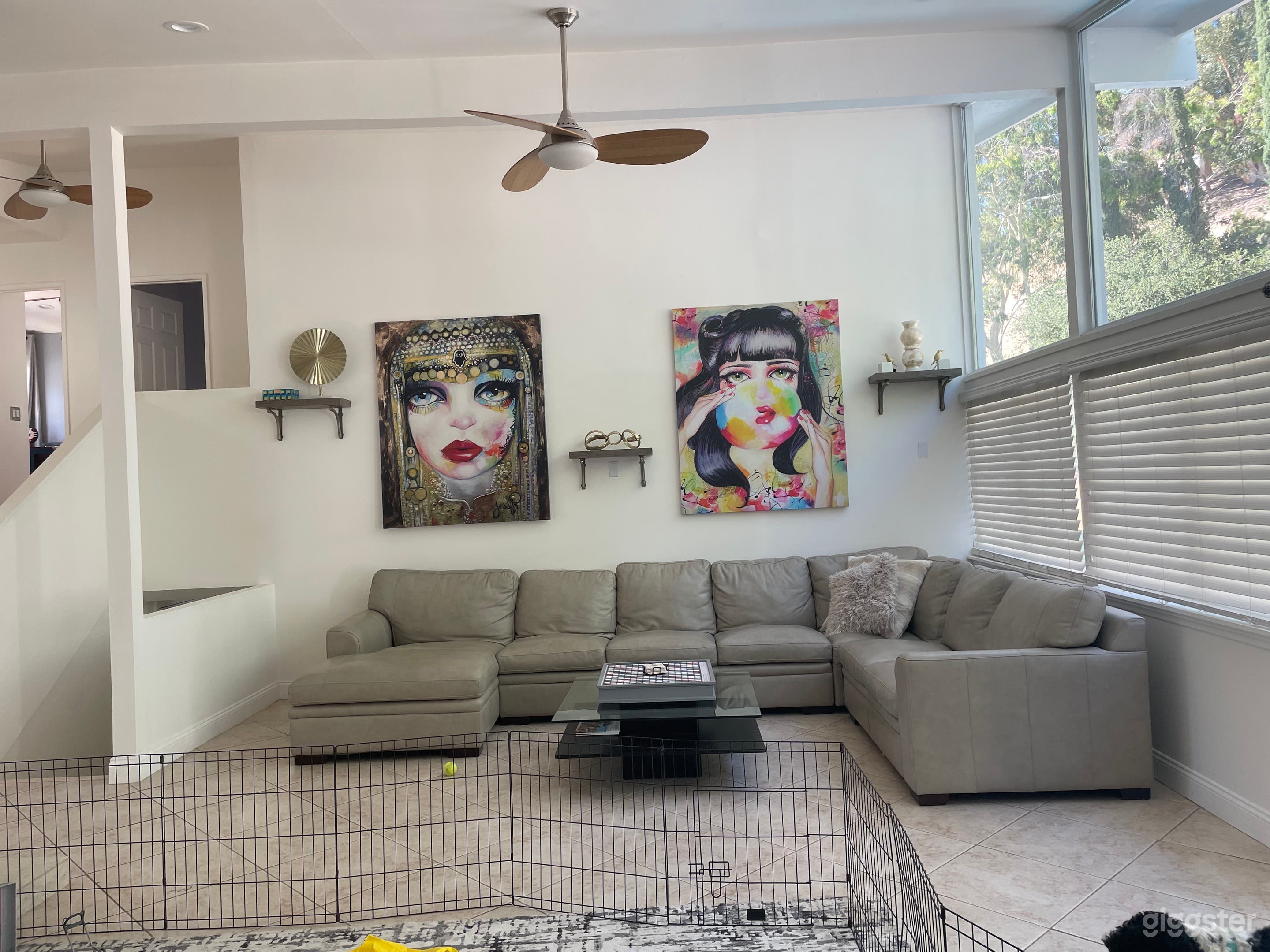 Livingroom.  To the right is a window wall. 