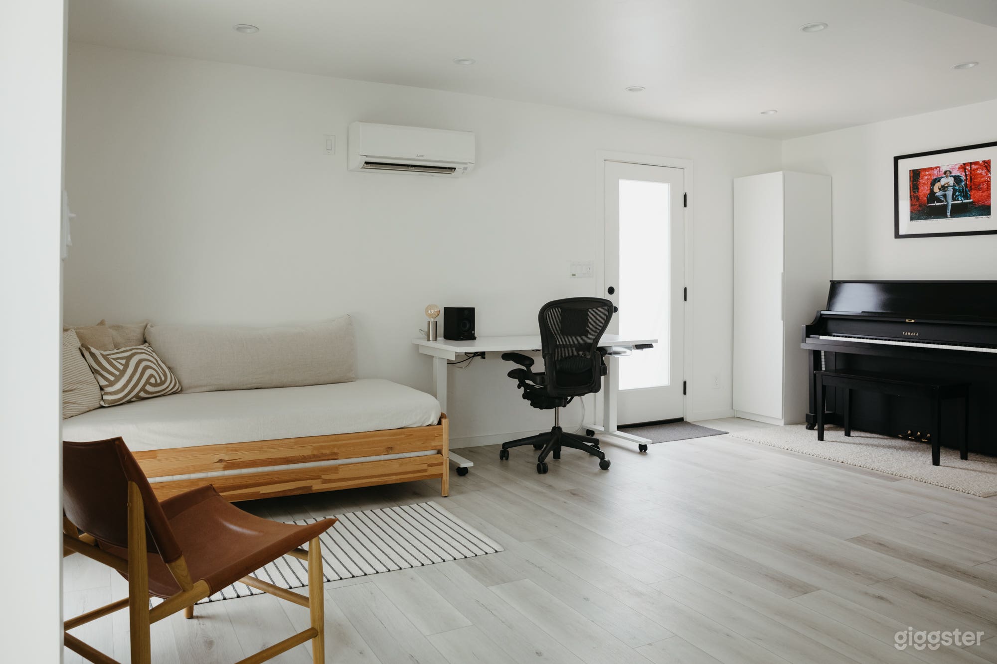 Piano, standing desk, and daybed