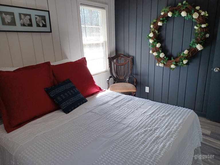  Upstairs bedroom with accent wall and soft, chill decor 