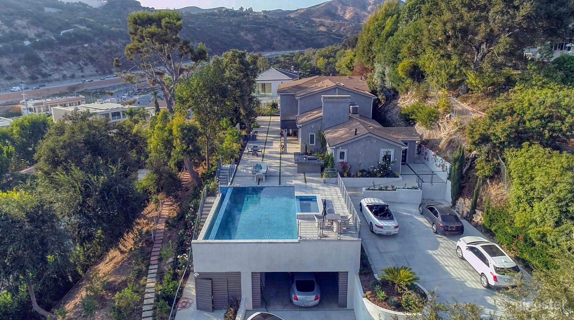 Sprawling Hillside Mansion with Jetliner Views Photo 1