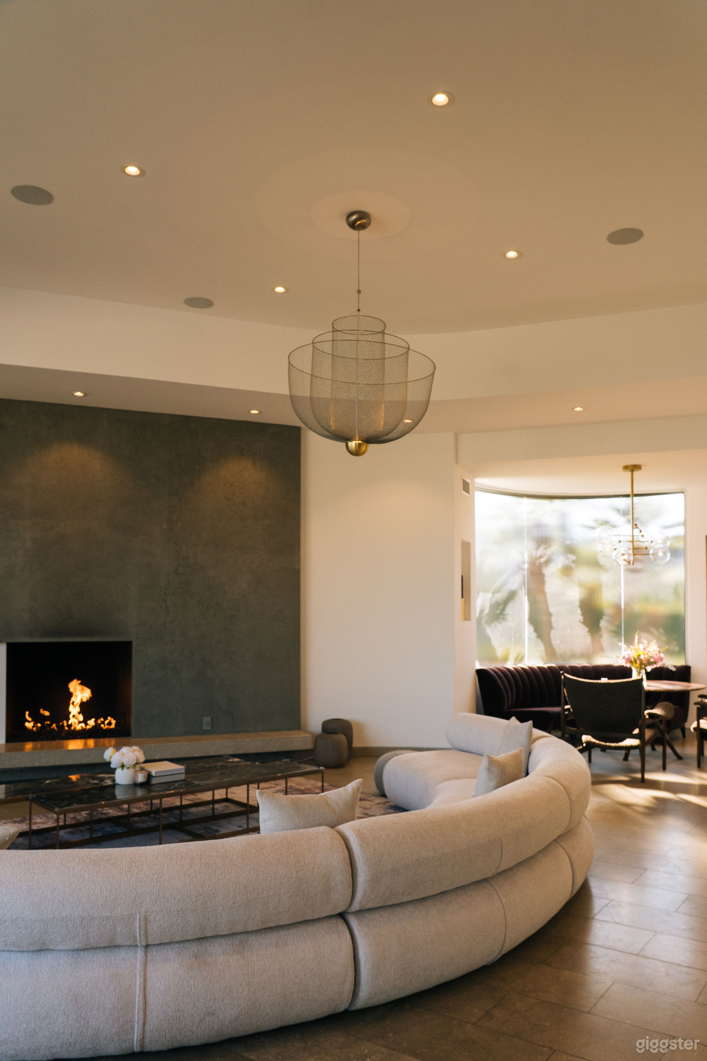 Family room with fireplace, adjacent to open kitchen and breakfast nook