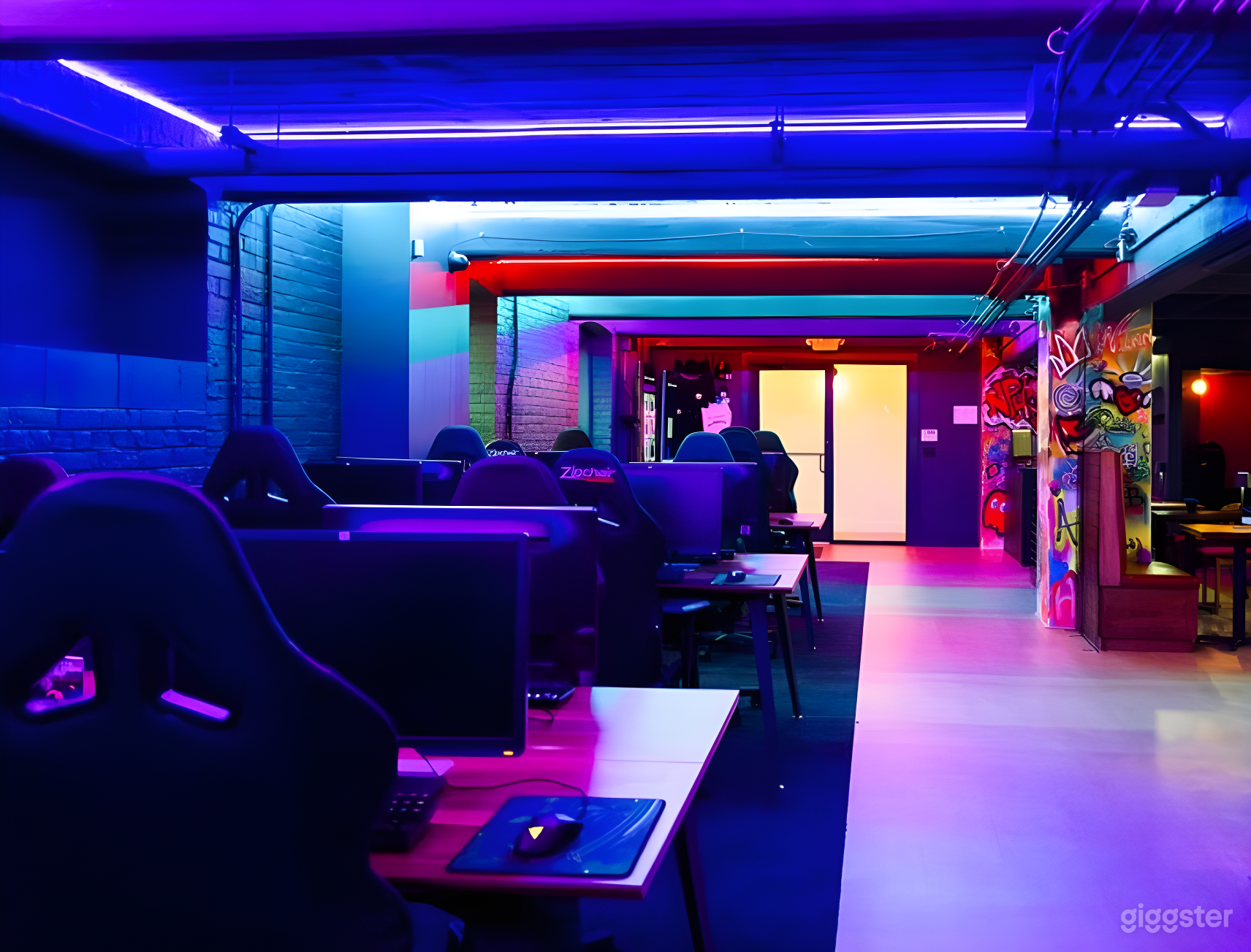 Neon-lit Open Gaming Floor with Pro PCs Photo 2