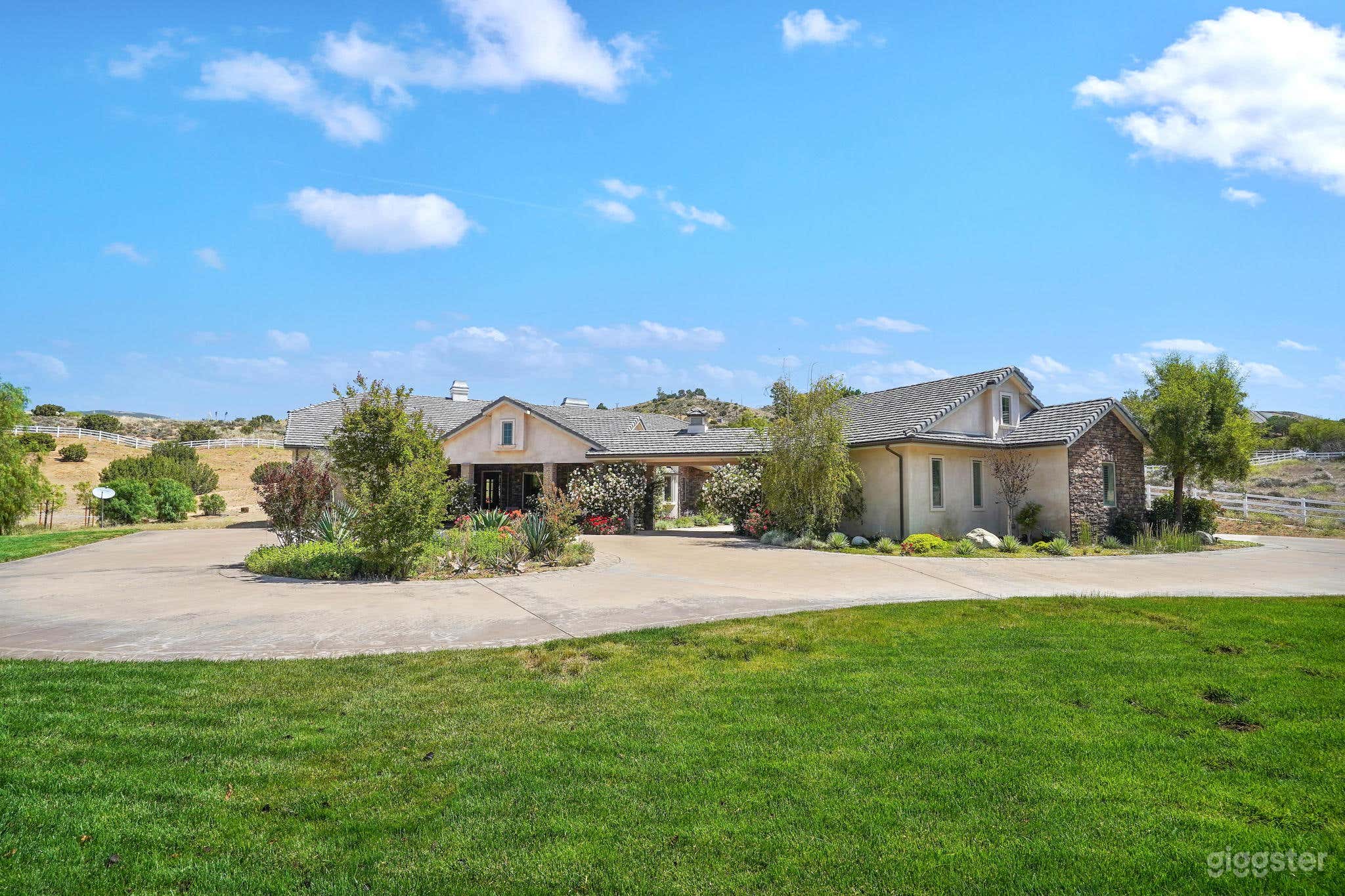 Front yard with lawn and circular driveway