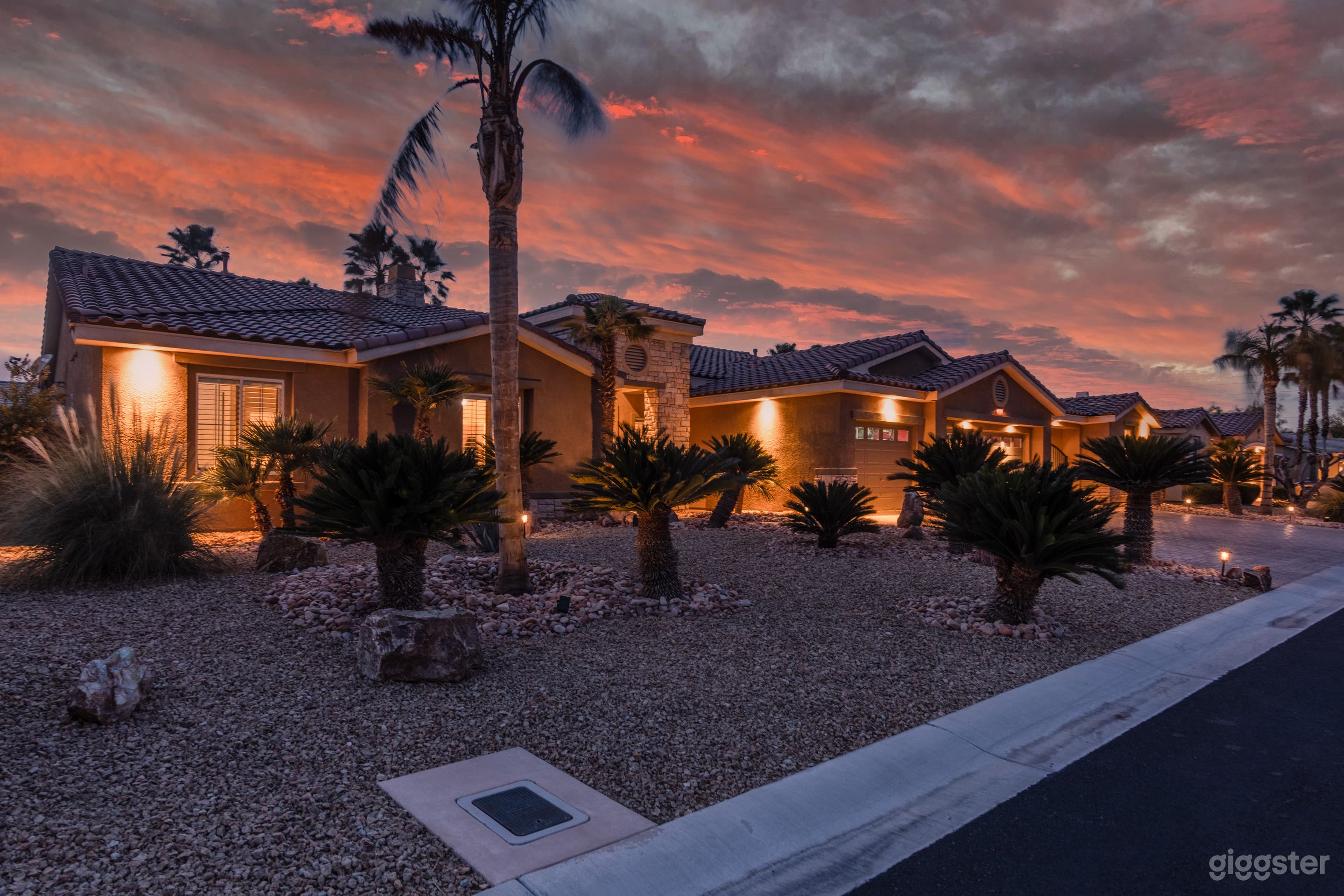 Night view of desert oasis home exterior