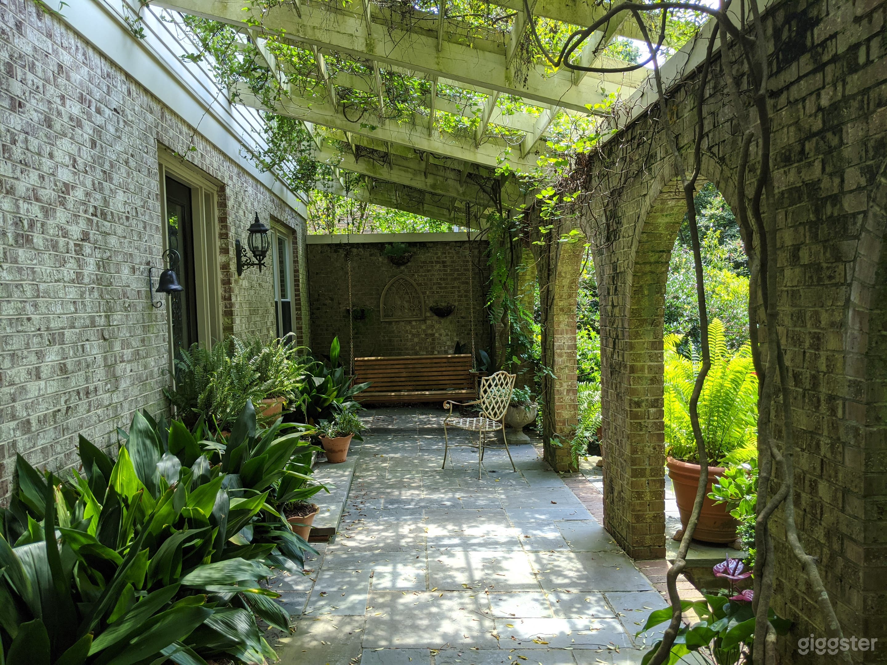 Ivy-covered veranda with brick arches