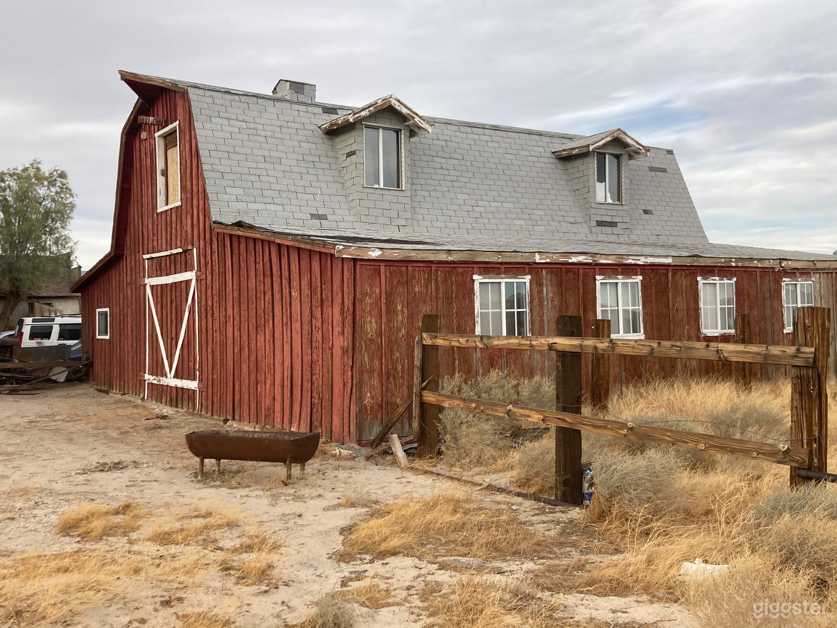 Barn has trash inside leftover from squatters, its a mess.
