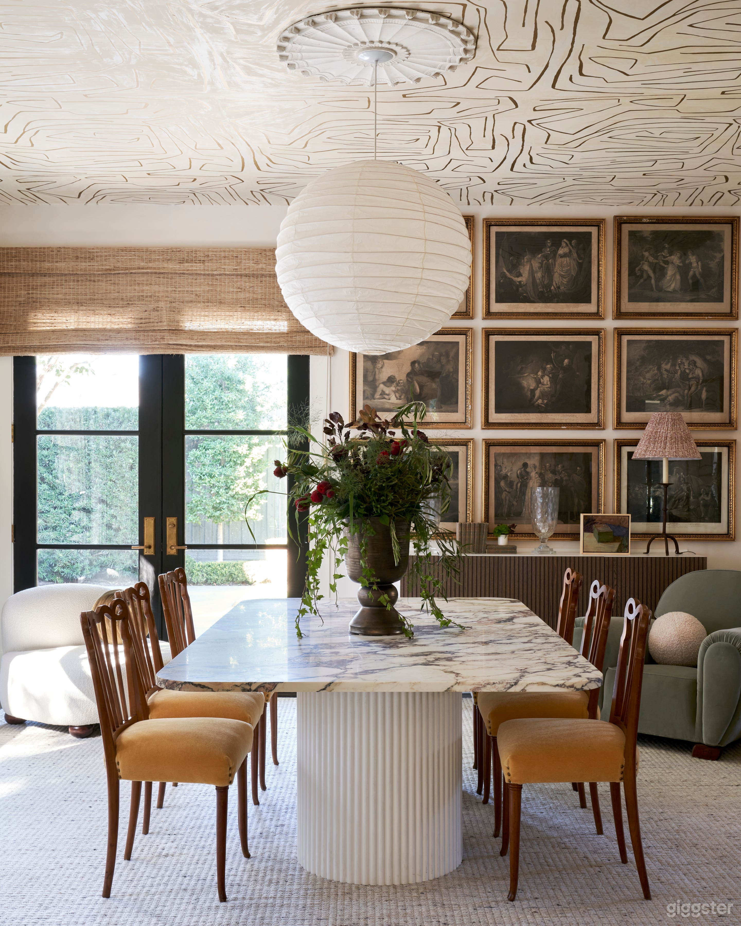 View of the dining room/ conference room from the living room. French doors lead to the formal backyard.