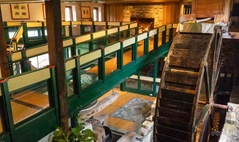  Overhead view of water wheel and elevated walkway within the Mill building. 