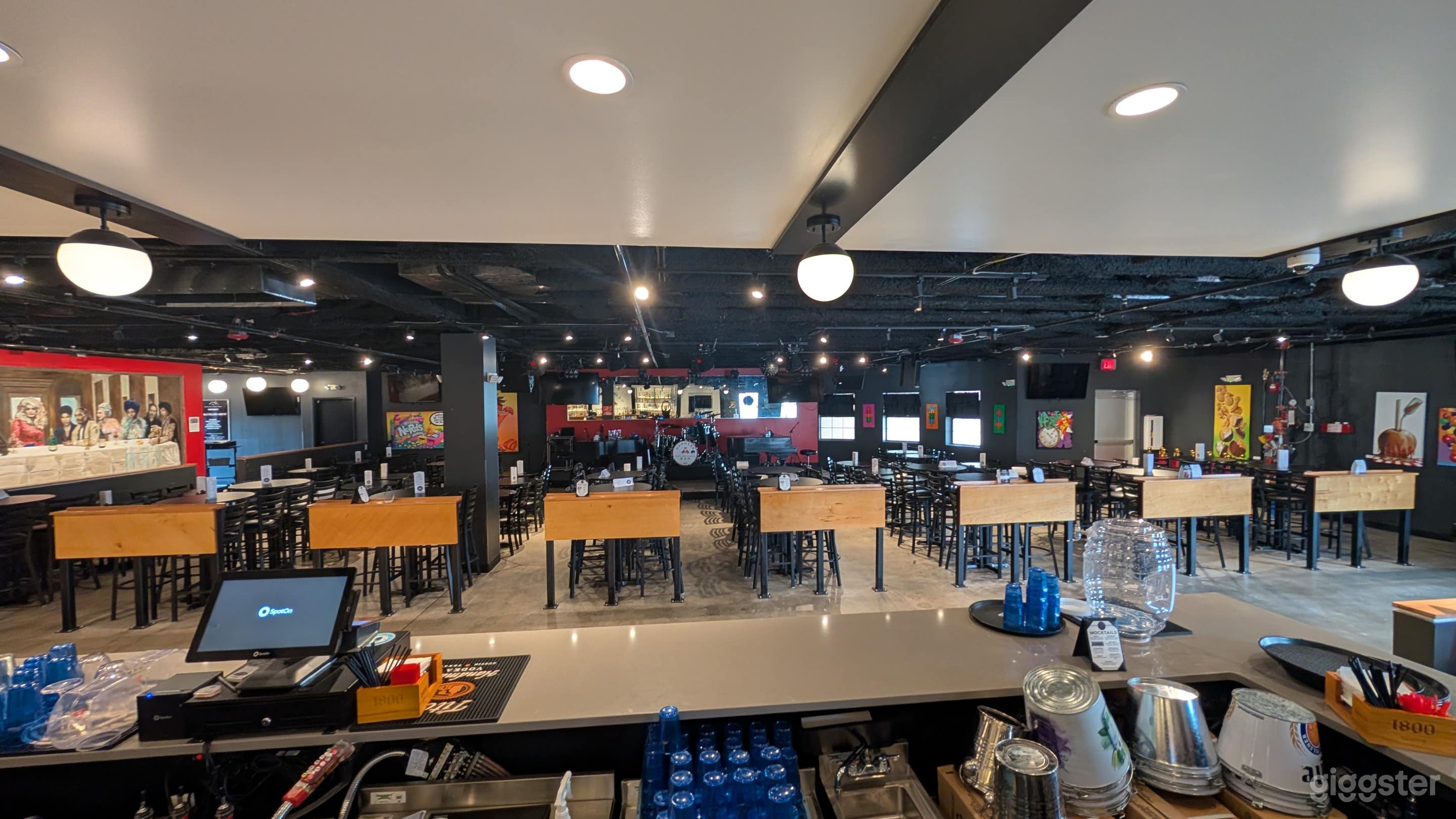 Welcoming space with local art, AV equipment, and full bar. Photo 2