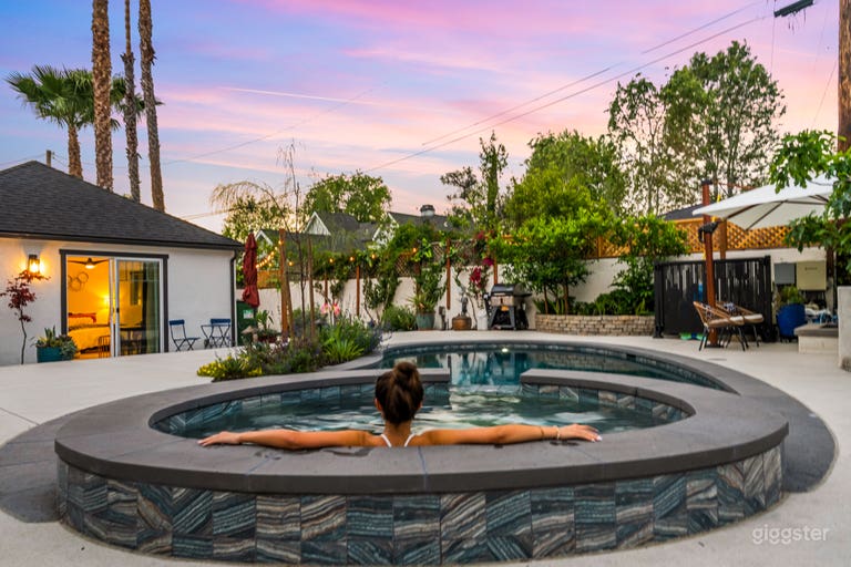  Our serene backyard oasis features a heated spa, sparkling pool, and lush greenery—framed by cotton candy skies at golden hour. Whether you&#x27;re capturing relaxed luxury, lifestyle content, or summer vibes, this space delivers cinematic charm with every shot 