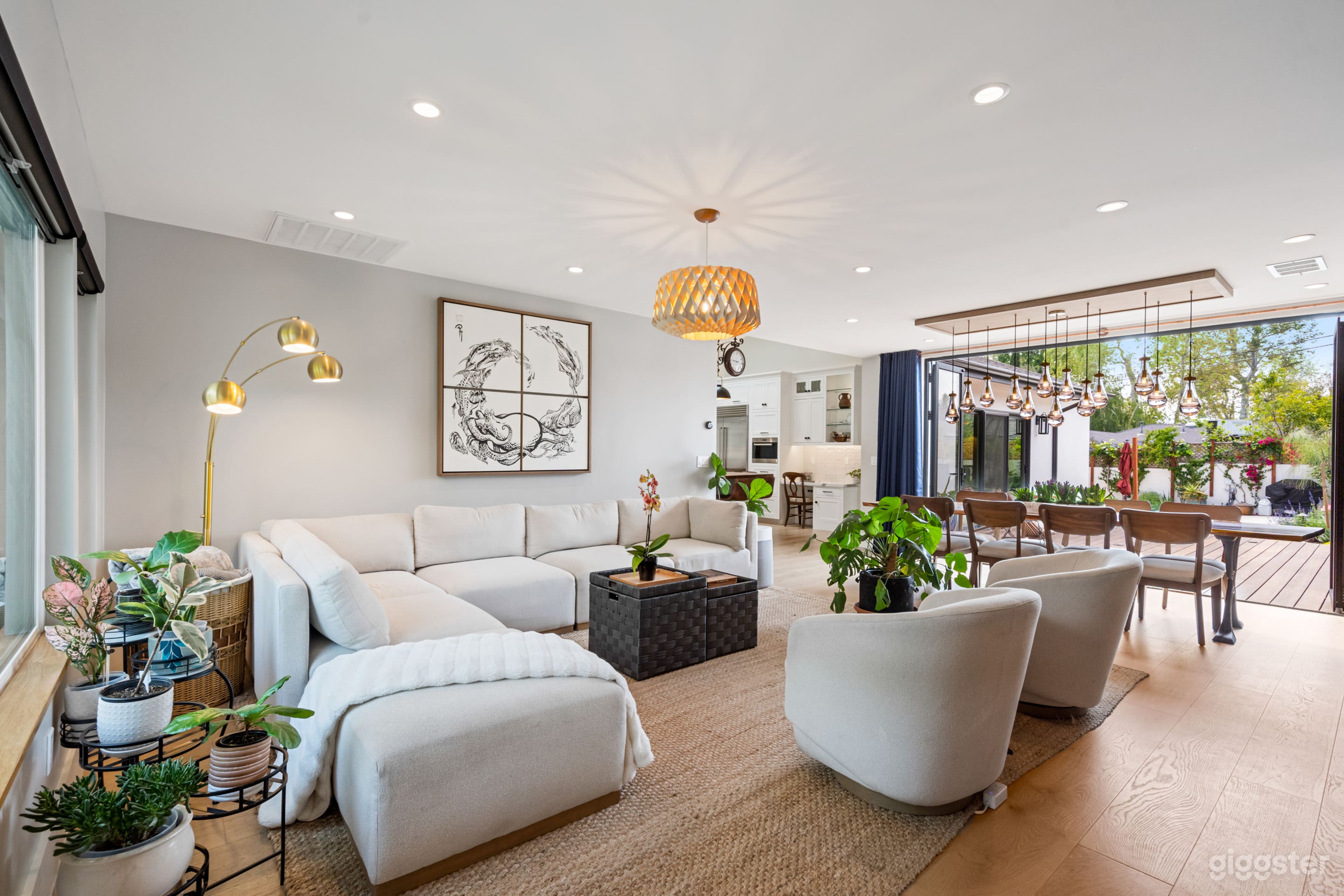 Our open-concept living area blends comfort and charm with a roomy L-shaped sofa, rustic textures, and soft natural light. Slide open the back door and step right into the backyard — it’s a seamless indoor-outdoor flow made for relaxed shoots, gatherings, 