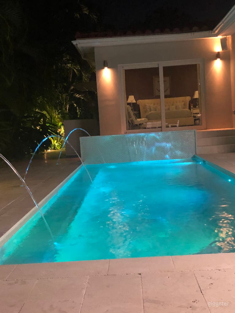  Beautiful pool with waterfall and water features. Multi color lighting.  