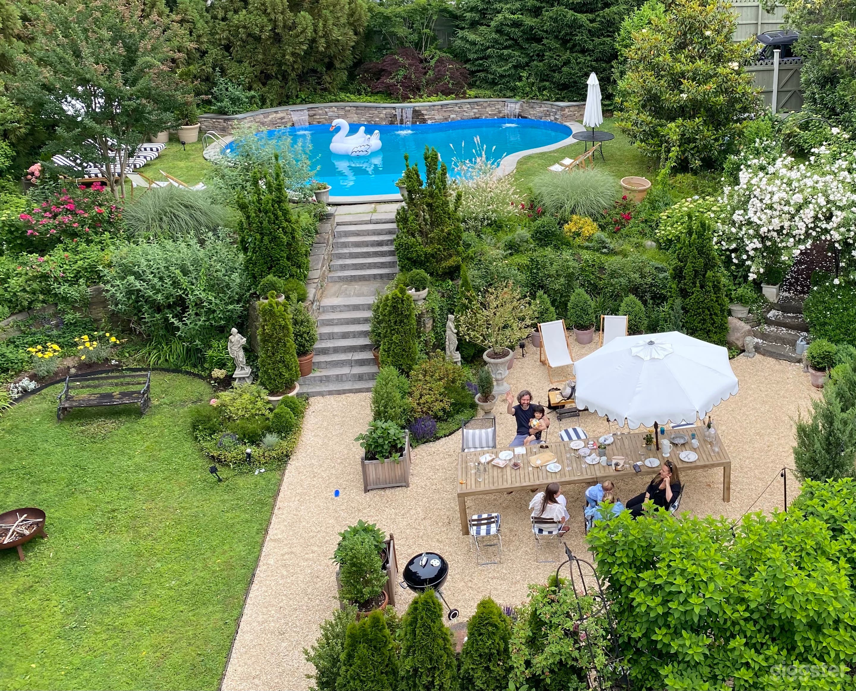 Landscaped gardens with lush lawn, entertaining area &amp; pool.