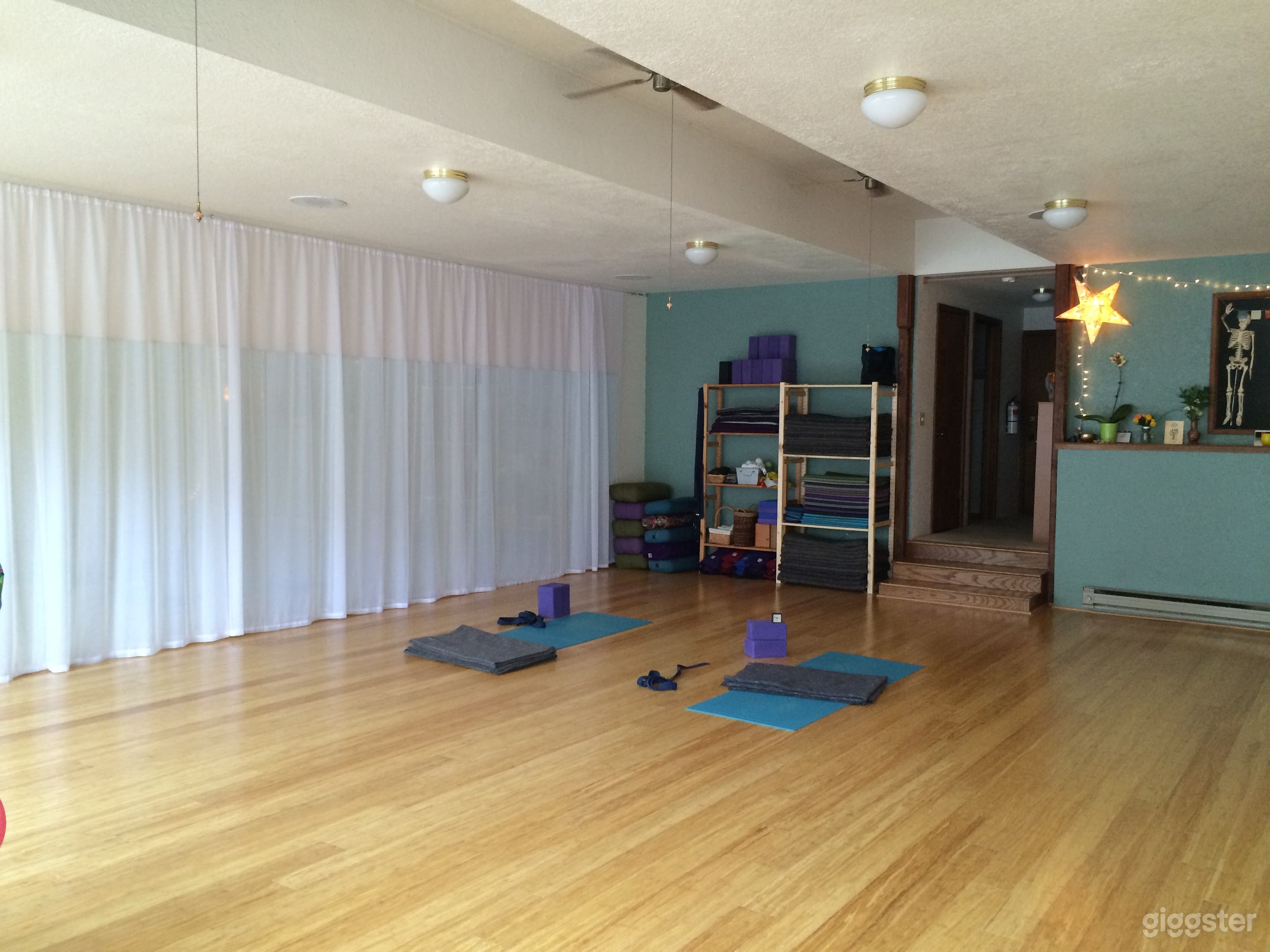 Wall of mirrors with sheer curtains
