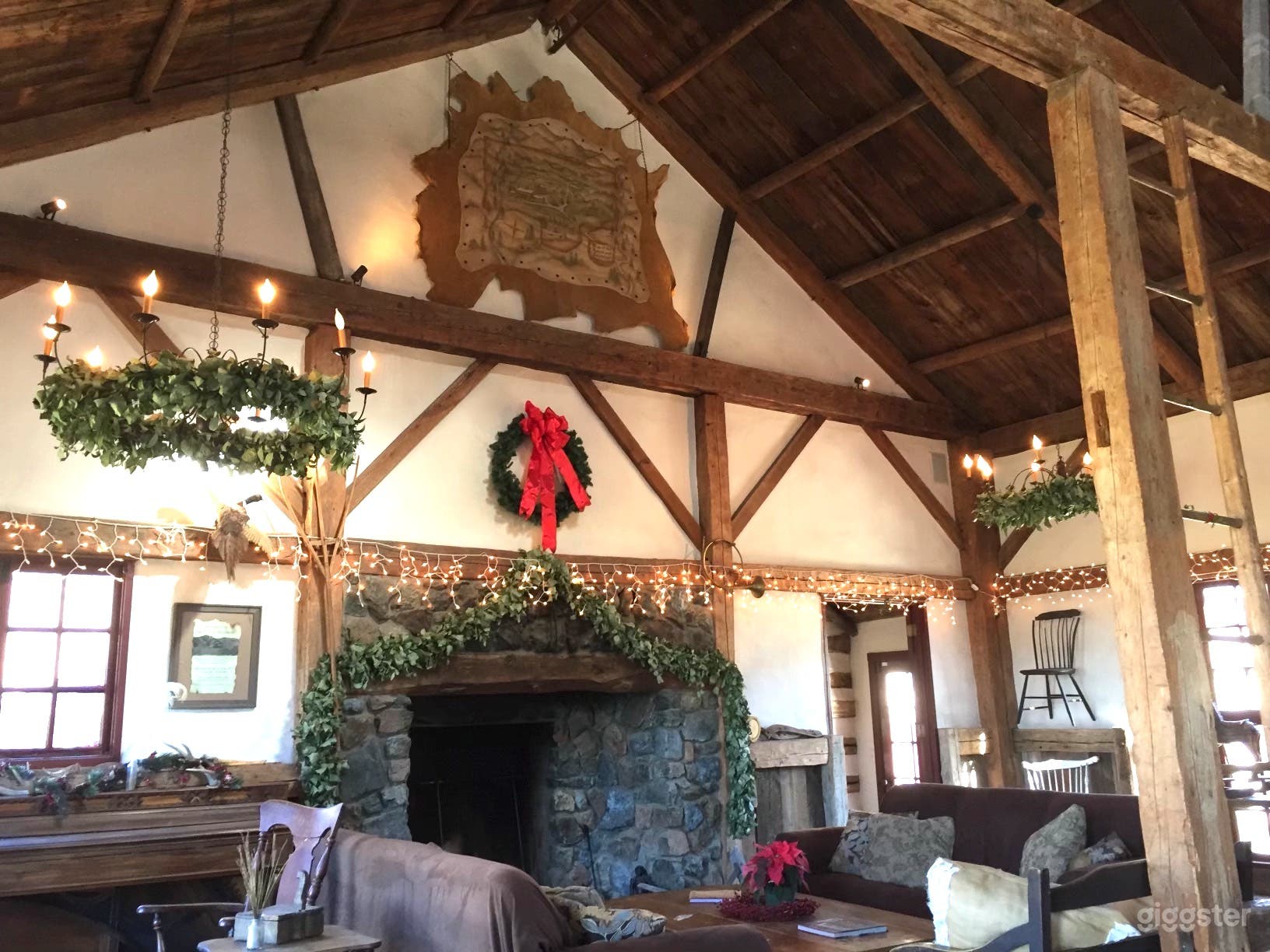 Grand living room with 25' ceiling and stone fireplace