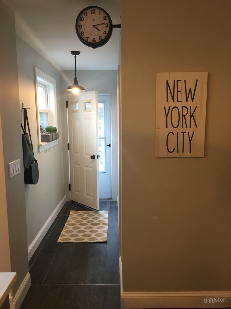  Back entrance to the house that leads into the kitchen. Main floor bathroom is off this hallway.  