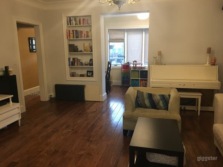  Main floor living room, office and foyer with hallway to upper level staircase.  