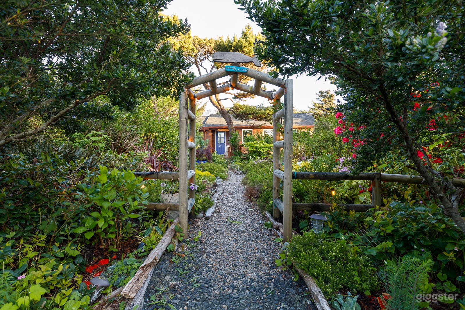 Cottage garden leading to front door.