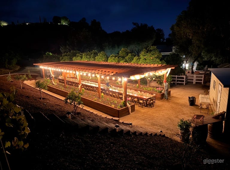  Charming Garden Venue with Pergola and Farmhouse Tables 