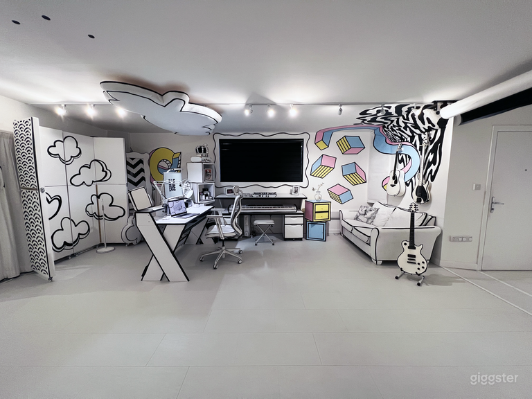  The music creating space. The panels on the left is a portable isolation booth for dampening sound. It can be folded down and the area behind the desk can be used for storage. 