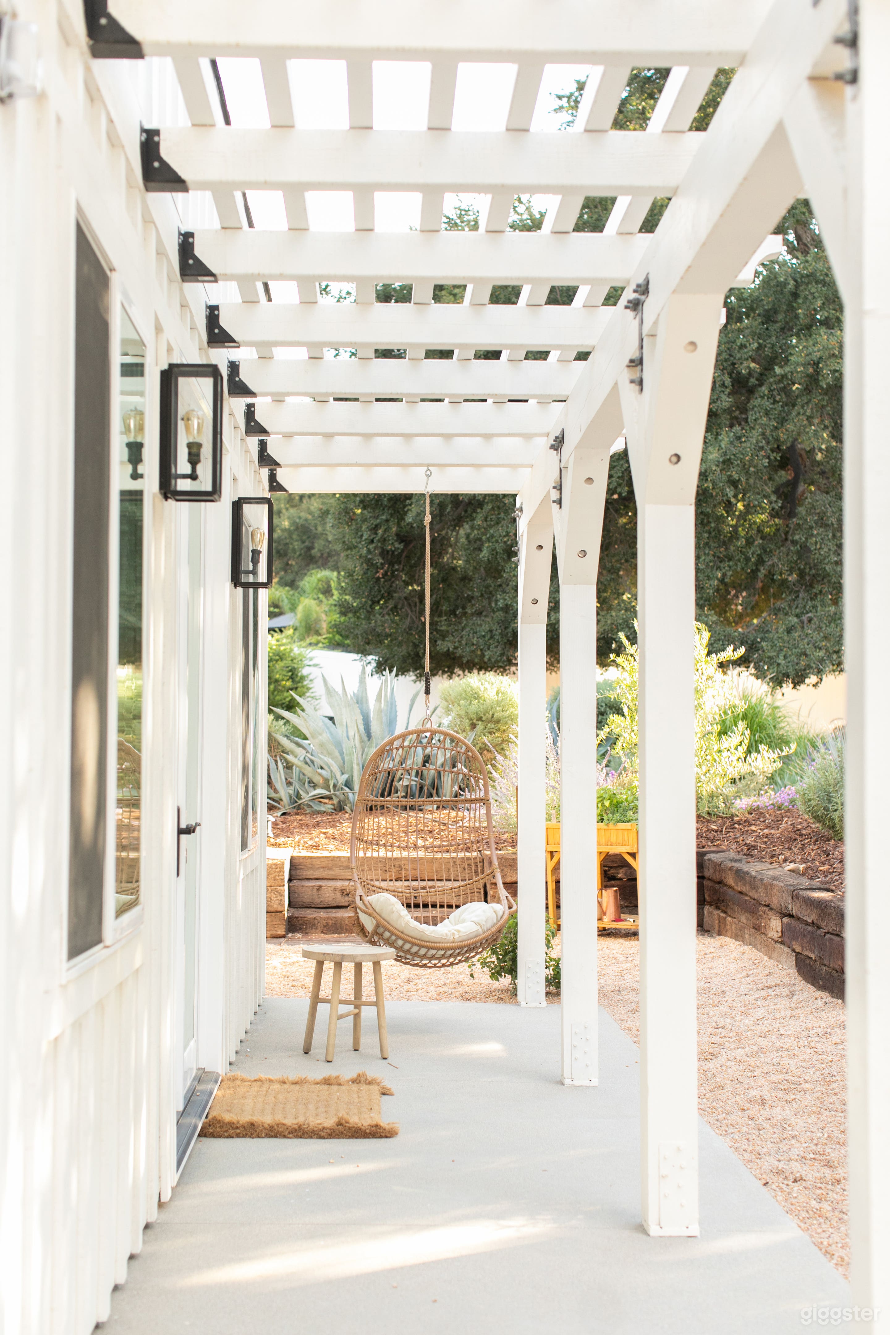 Swinging chair on the patio of the guest house. 