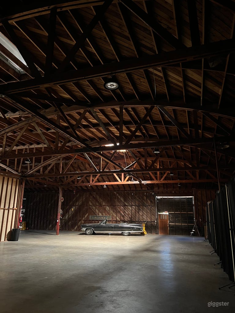  Features 26 foot ceilings. Redwood beam and truss construction. 