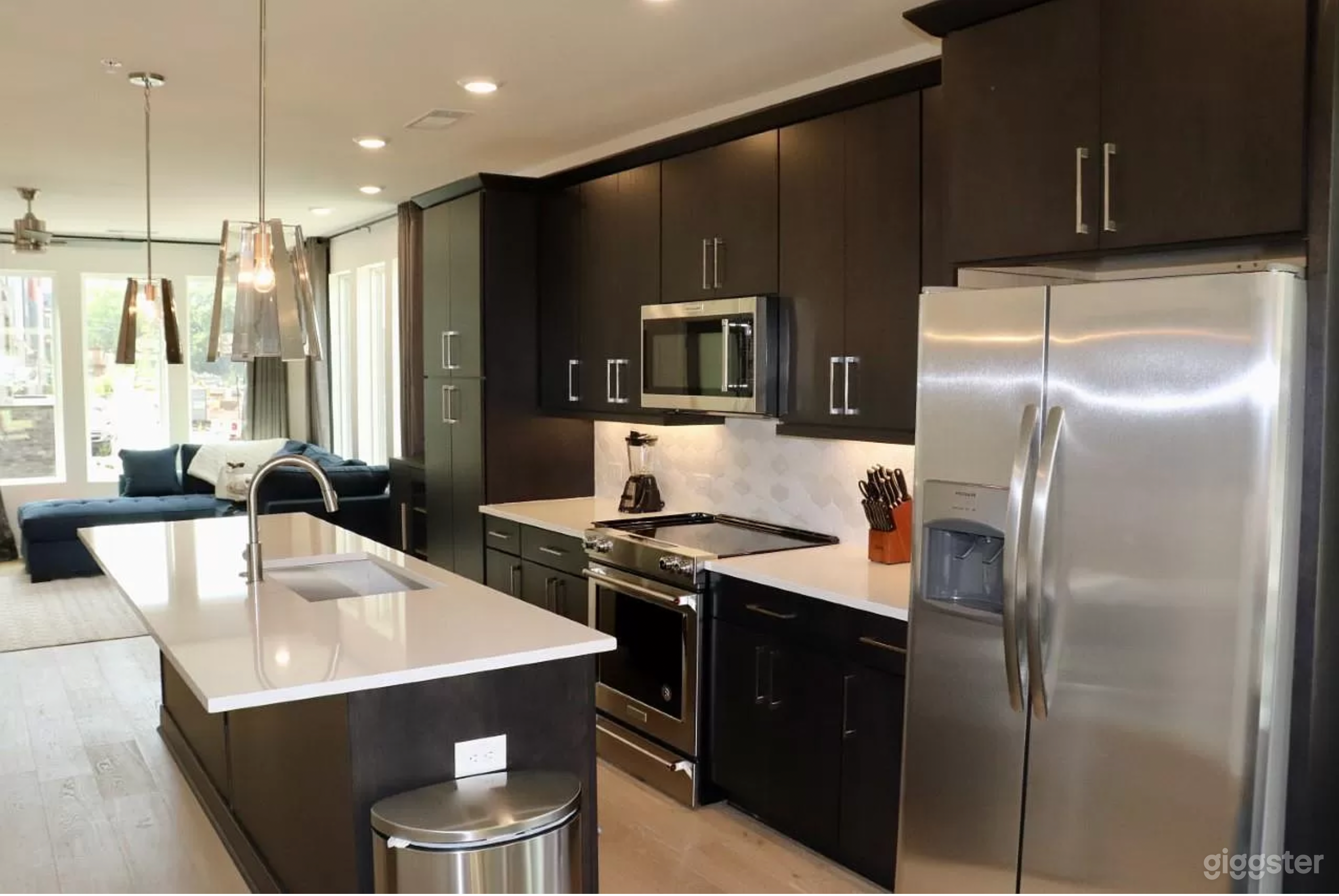 Kitchen with island (wall to floor windows overlooking the Beacon Sign)