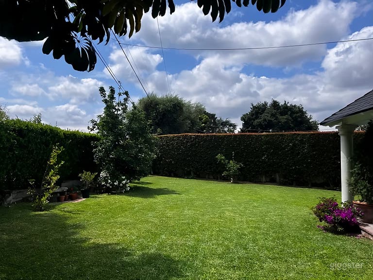  Lush Garden Backyard with Outdoor Fireplace 