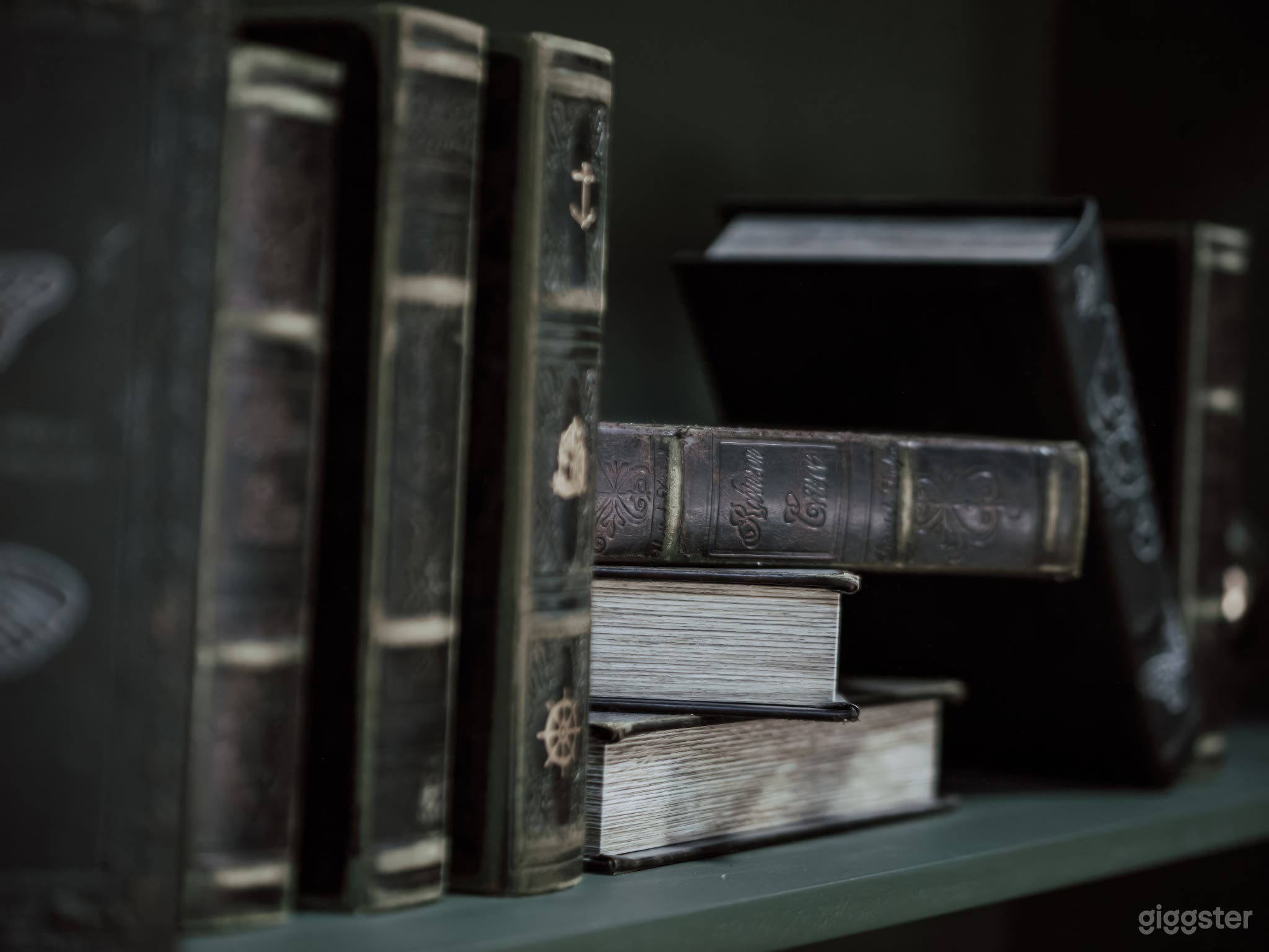 Antique books lend a sense of history and sophistication to our studio space, perfect for adding character and depth to your creative endeavors.