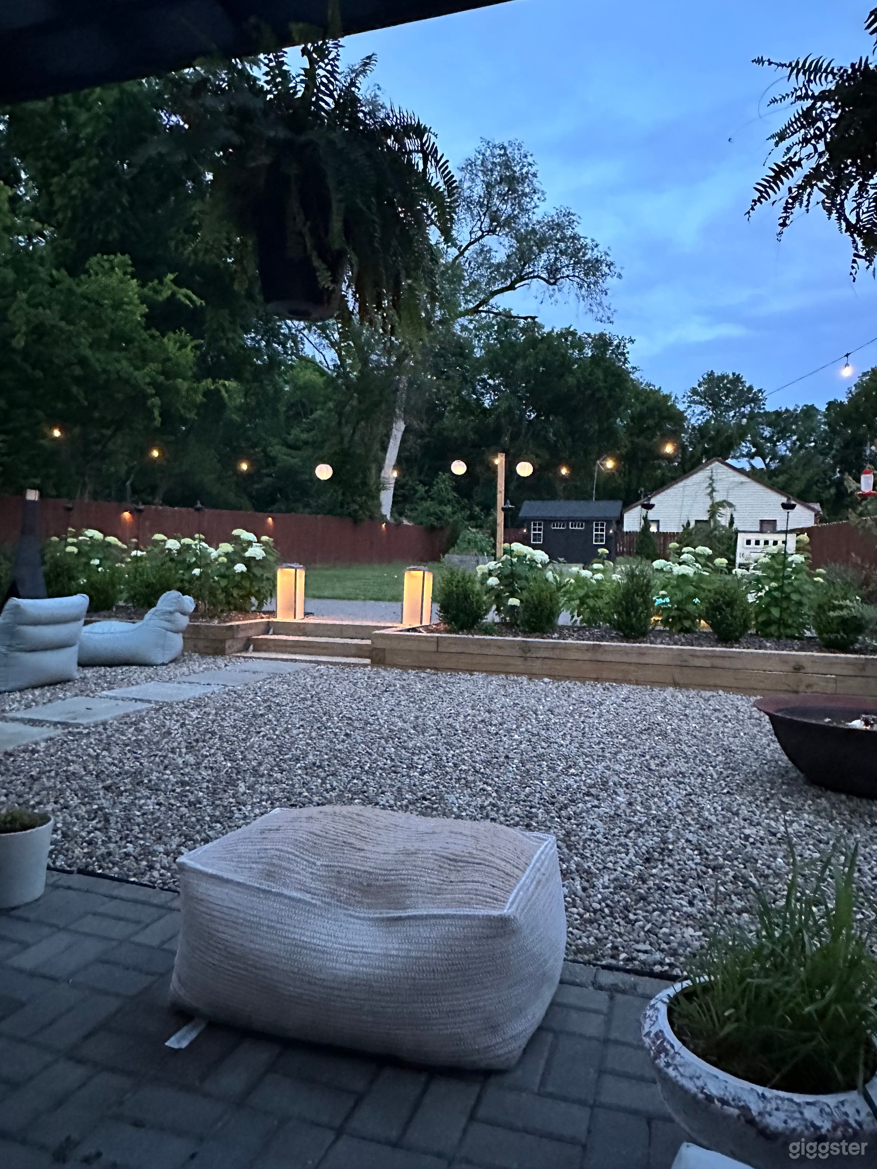 Beautifully landscaped backyard with Fountain, Firepit, and Bocce Ball Court