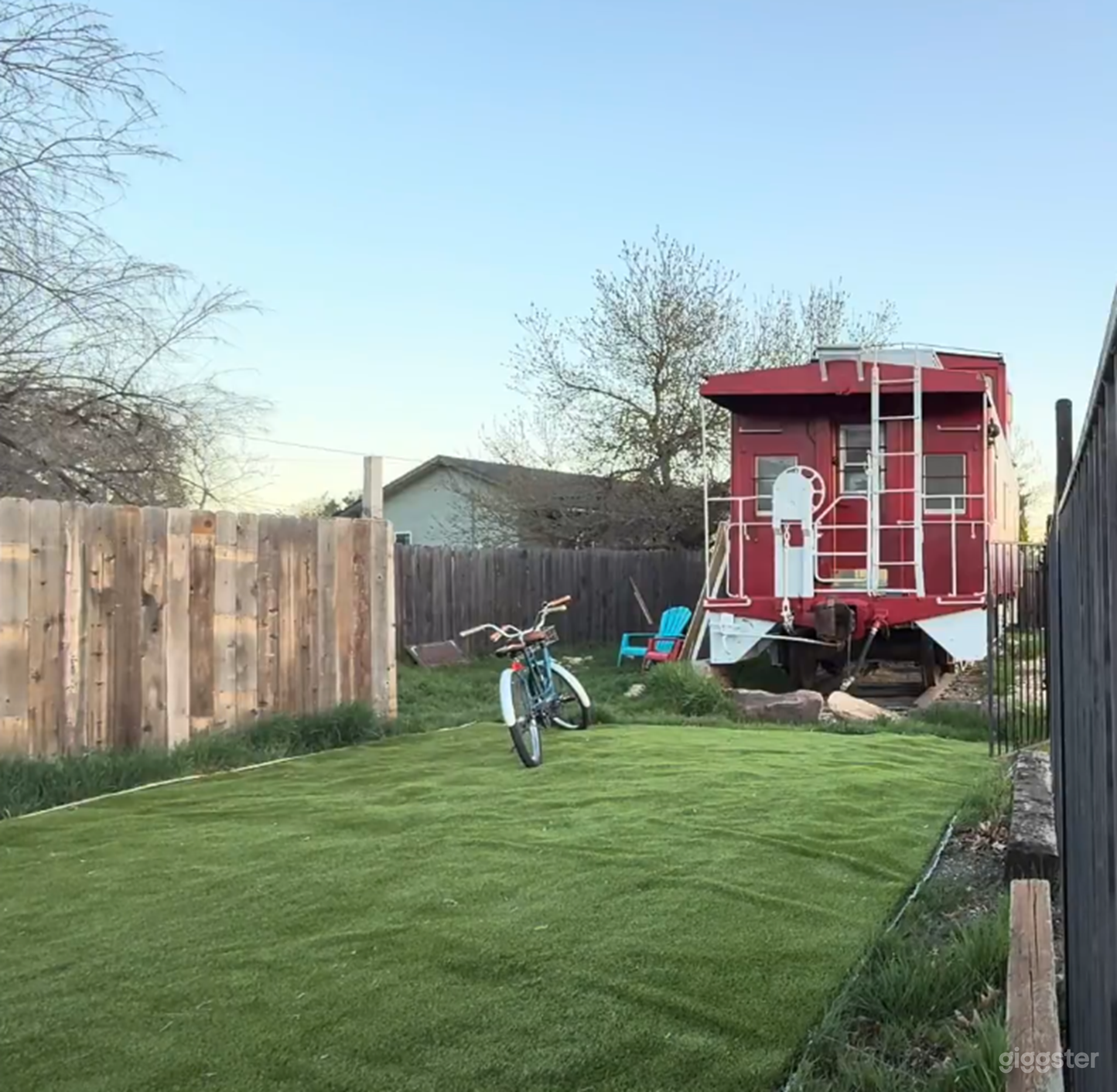Endshot of the caboose as viewed from the alley over the turf drive (where the cars park and pull in (this is fully fenced)