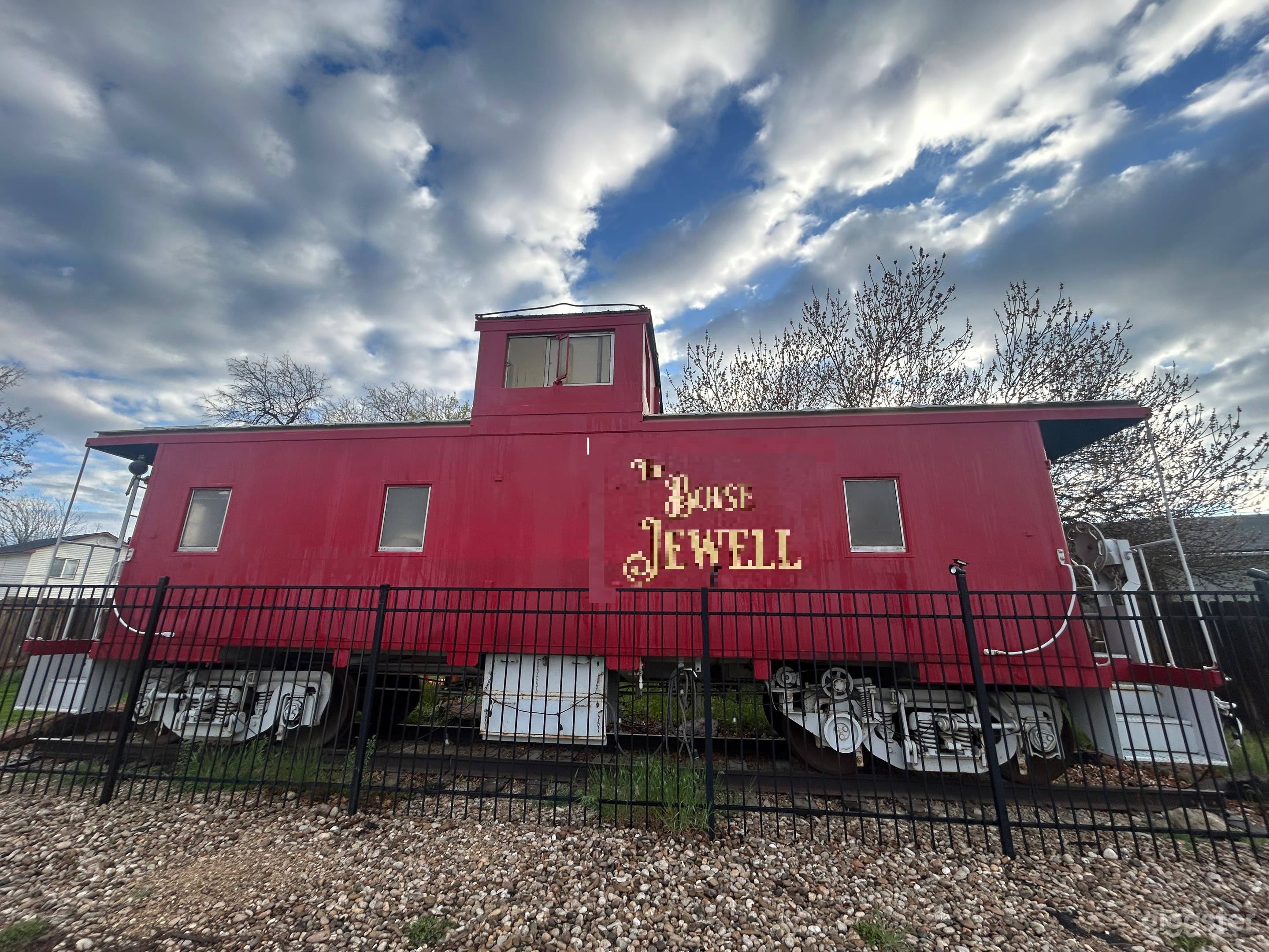 Side shot of the caboose as viewed from the sidewalk / street