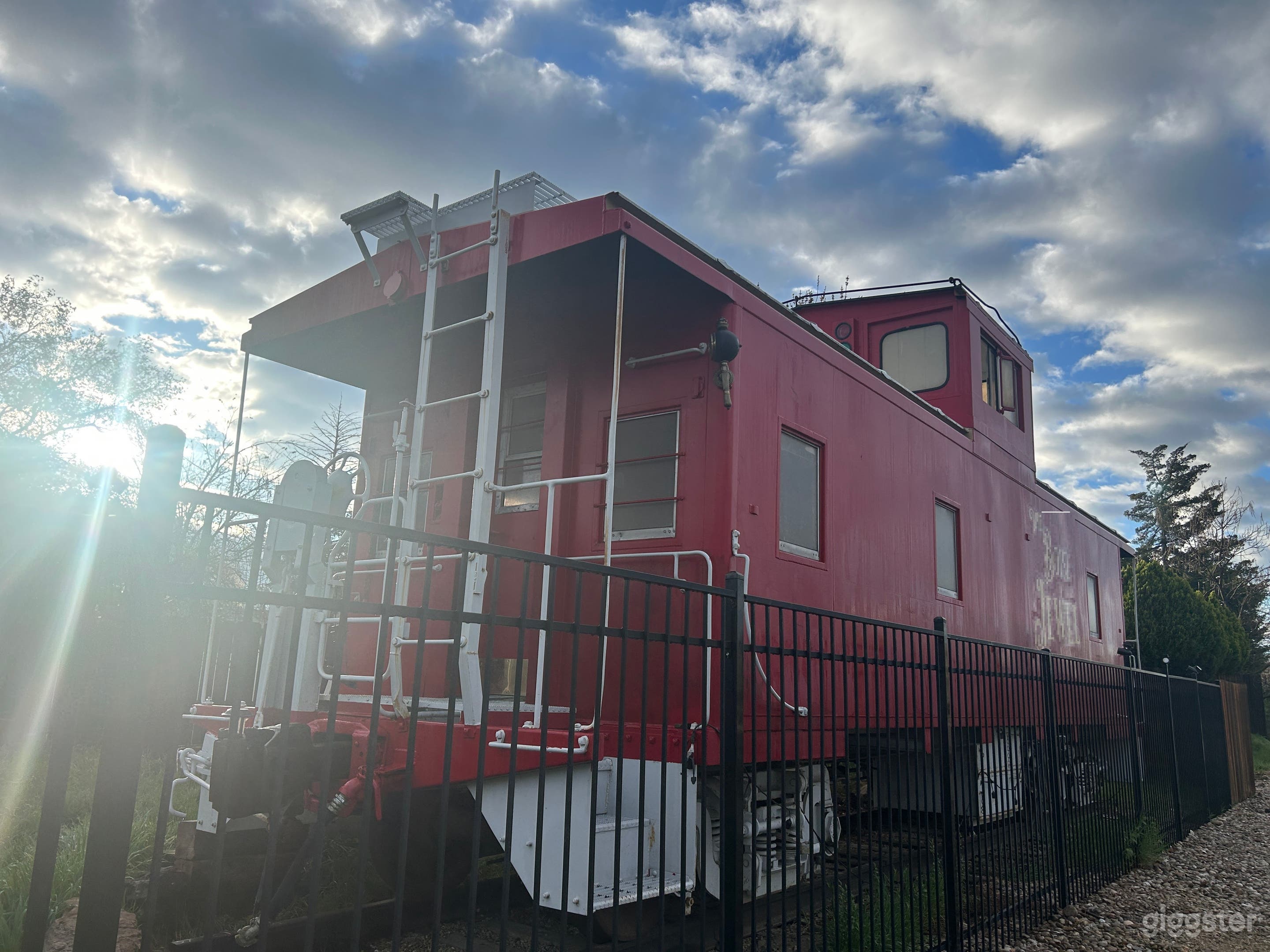The caboose as viewed from the sidewalk in the morning light