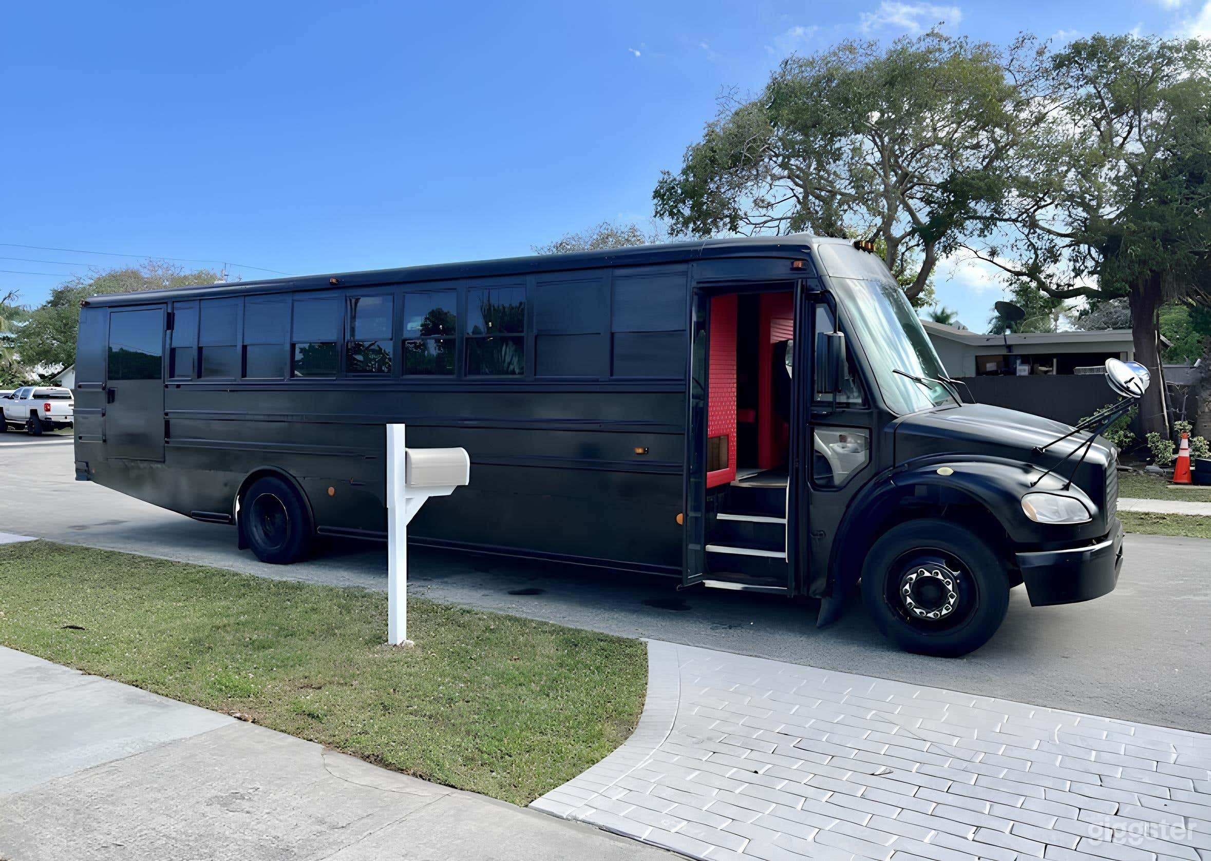 Black Party Bus with Crimson Interiors Photo 1