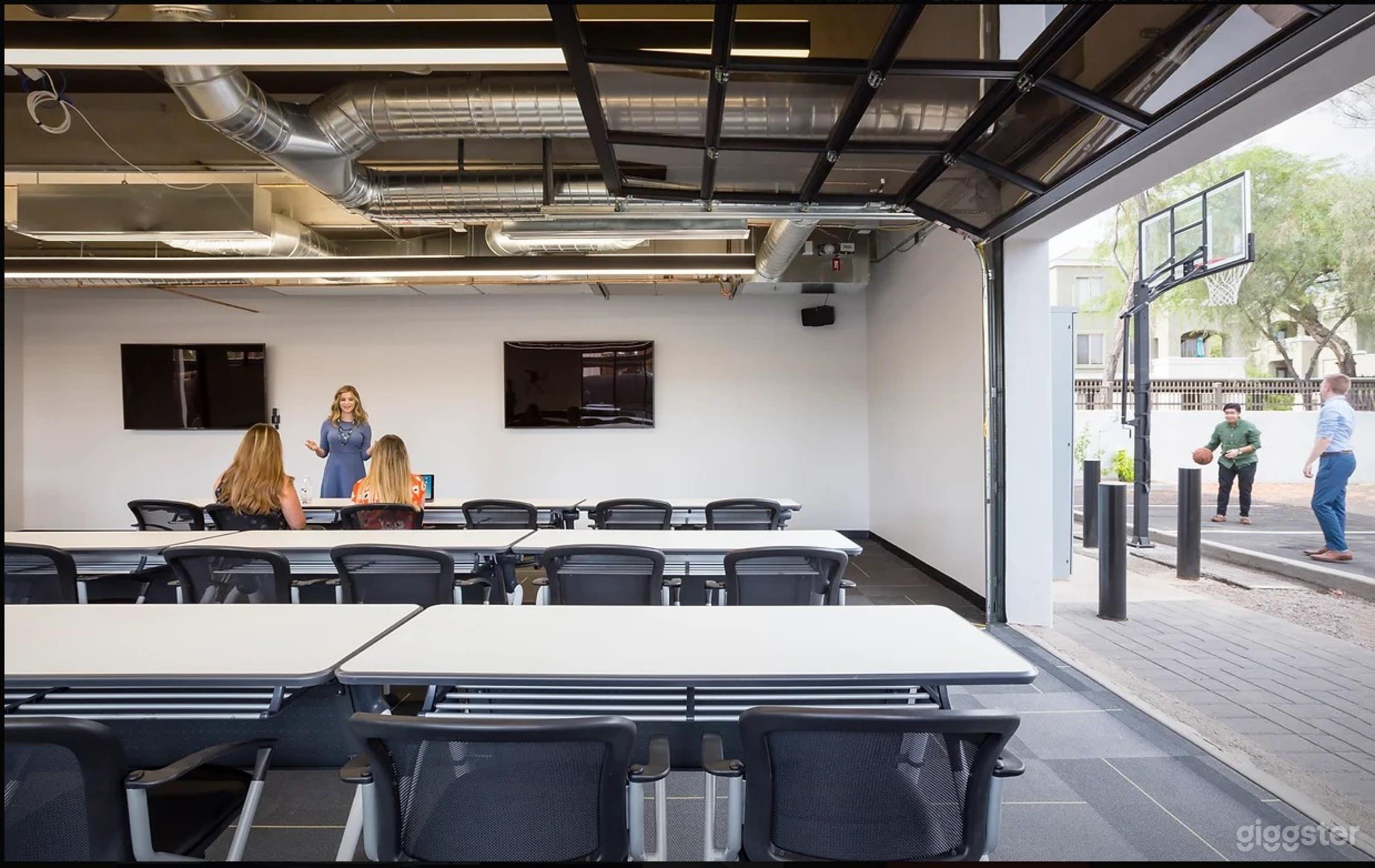 Indoor/outdoor space off the back includes shooting hoops on a break and a smoking bench