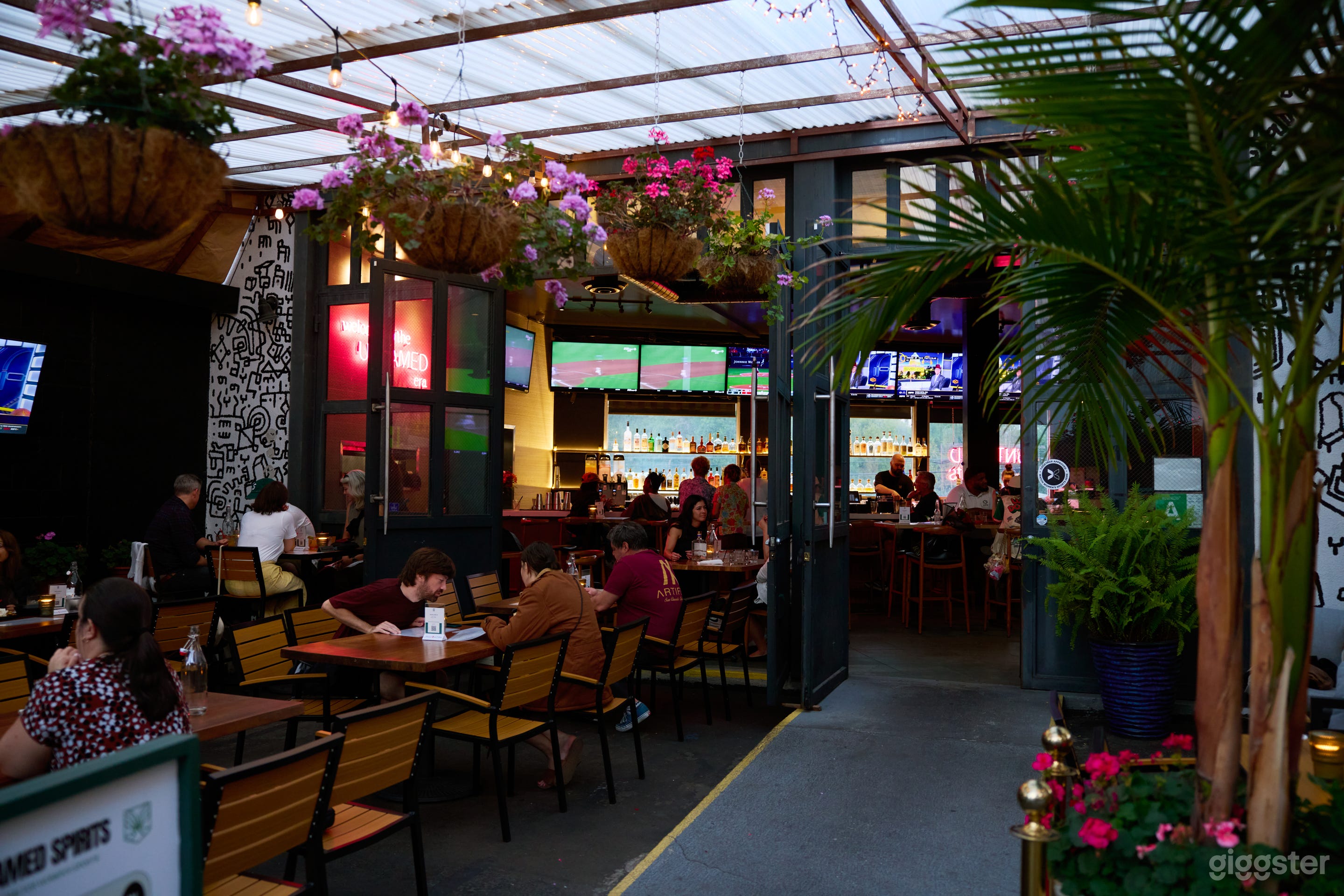 Urban Sports Bar with Lush Patio & Industrial Charm Photo 1