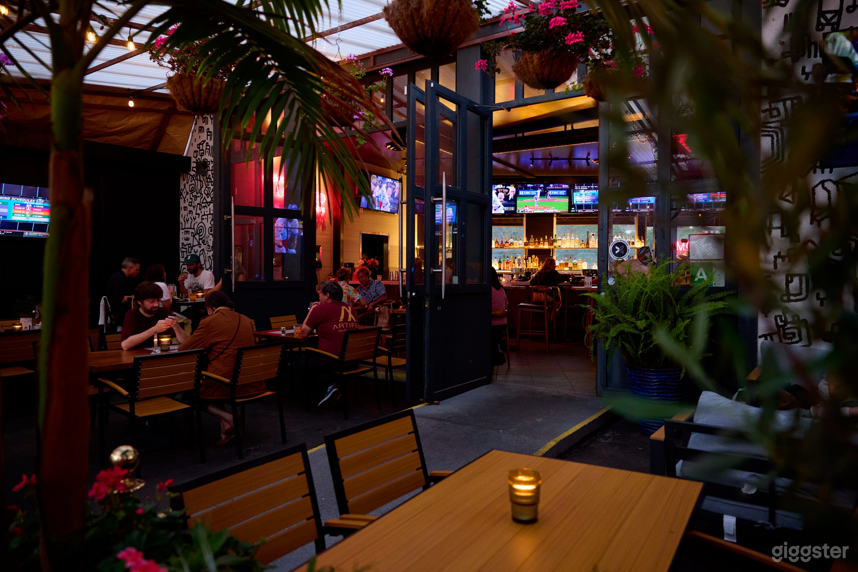 Urban Sports Bar with Lush Patio & Industrial Charm Photo 2