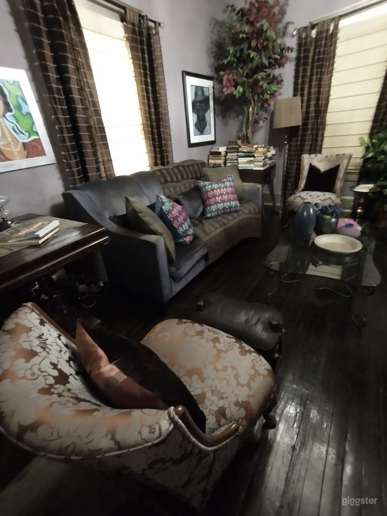  The living room is a colorful and eclectic mix of styles and cultures.  It is historical, comfortable, stylish.  With textured walls and bejeweled ceiling, not surface is left untouched.  