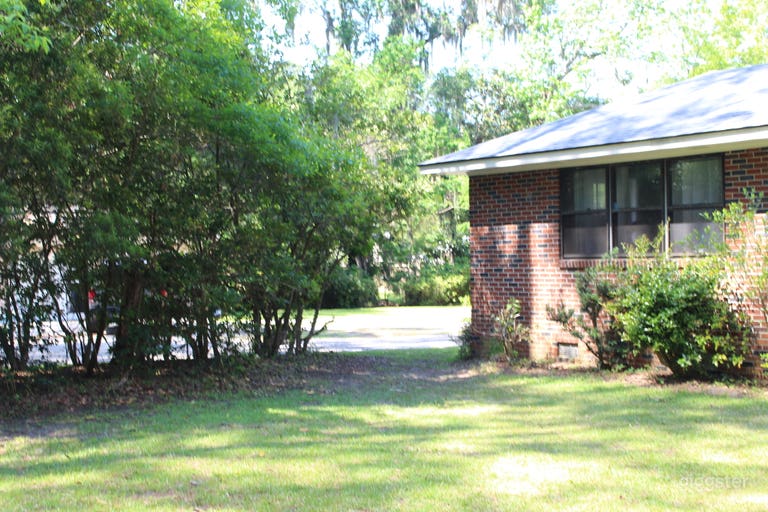  Mid-Century Brick Home on Expansive Riverfront Lot with Dock 