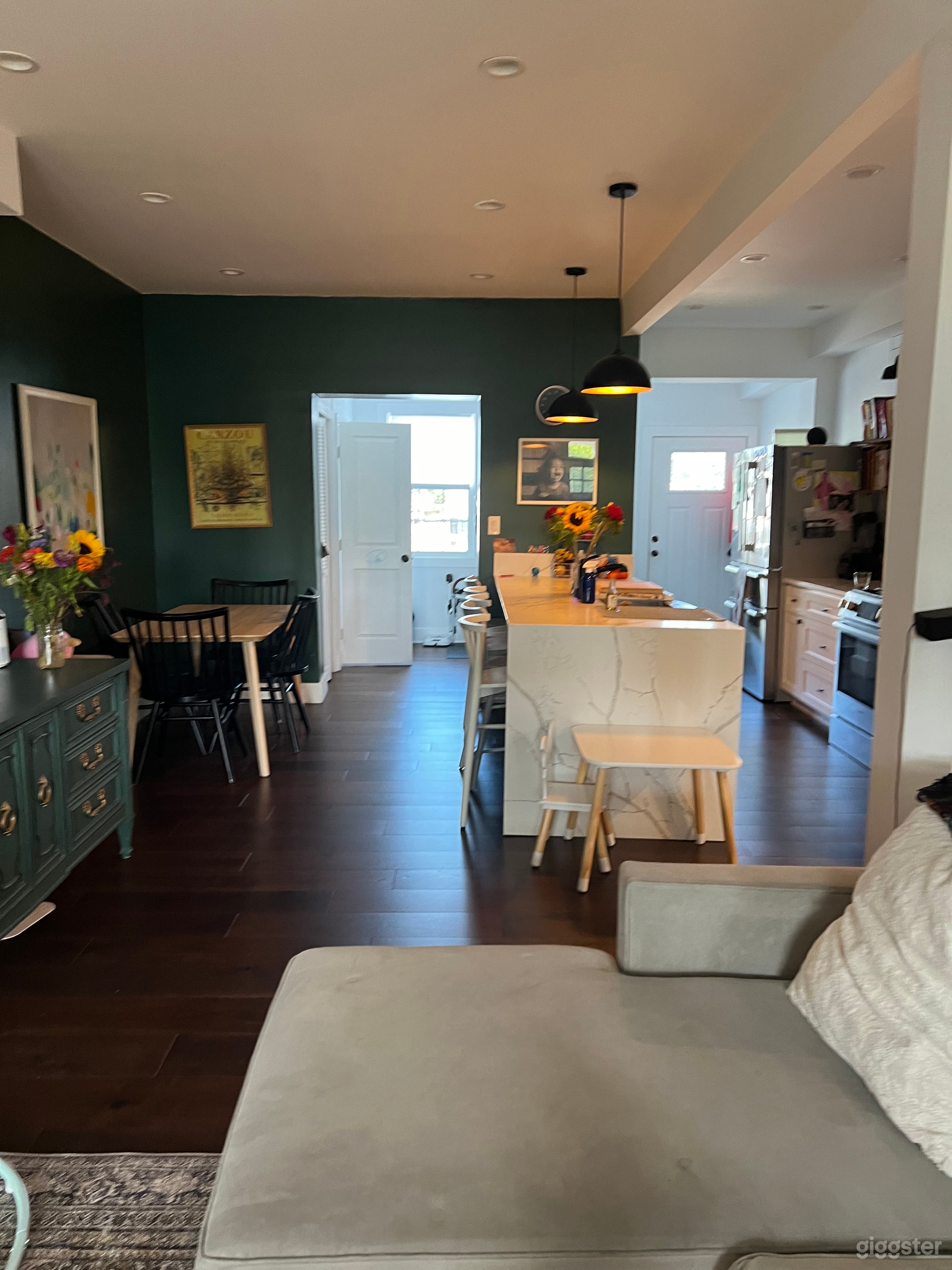 Open concept floor plan with kitchen and dining table. 