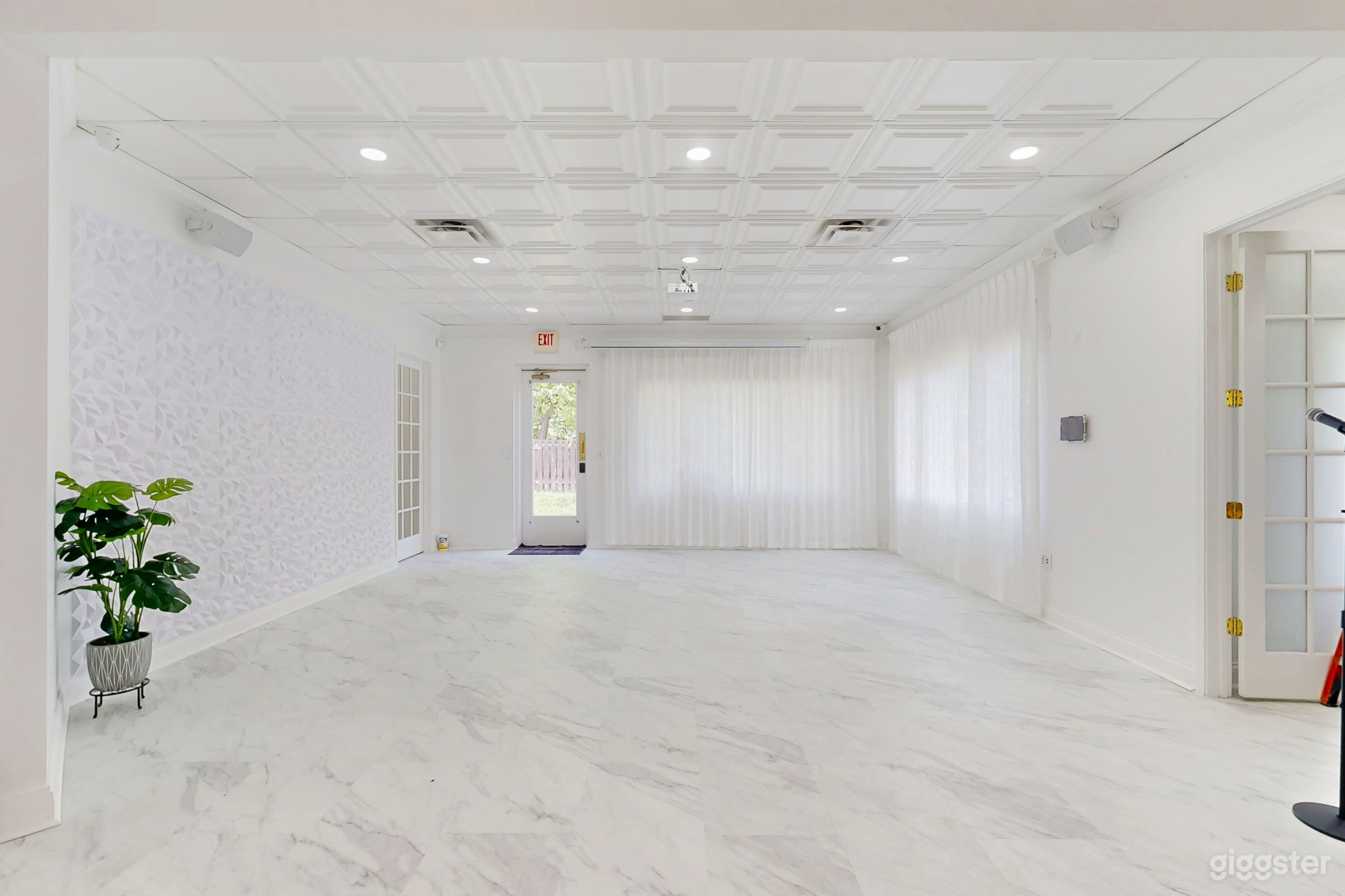 Host seating and backdrop decor area