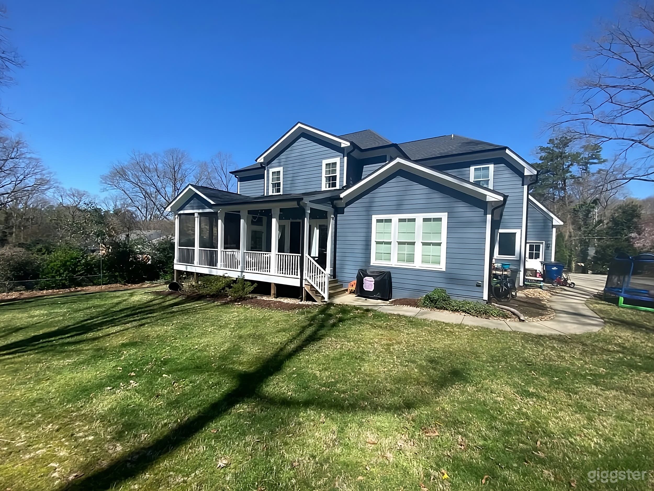 Charming Blue Home Backyard Photo 1