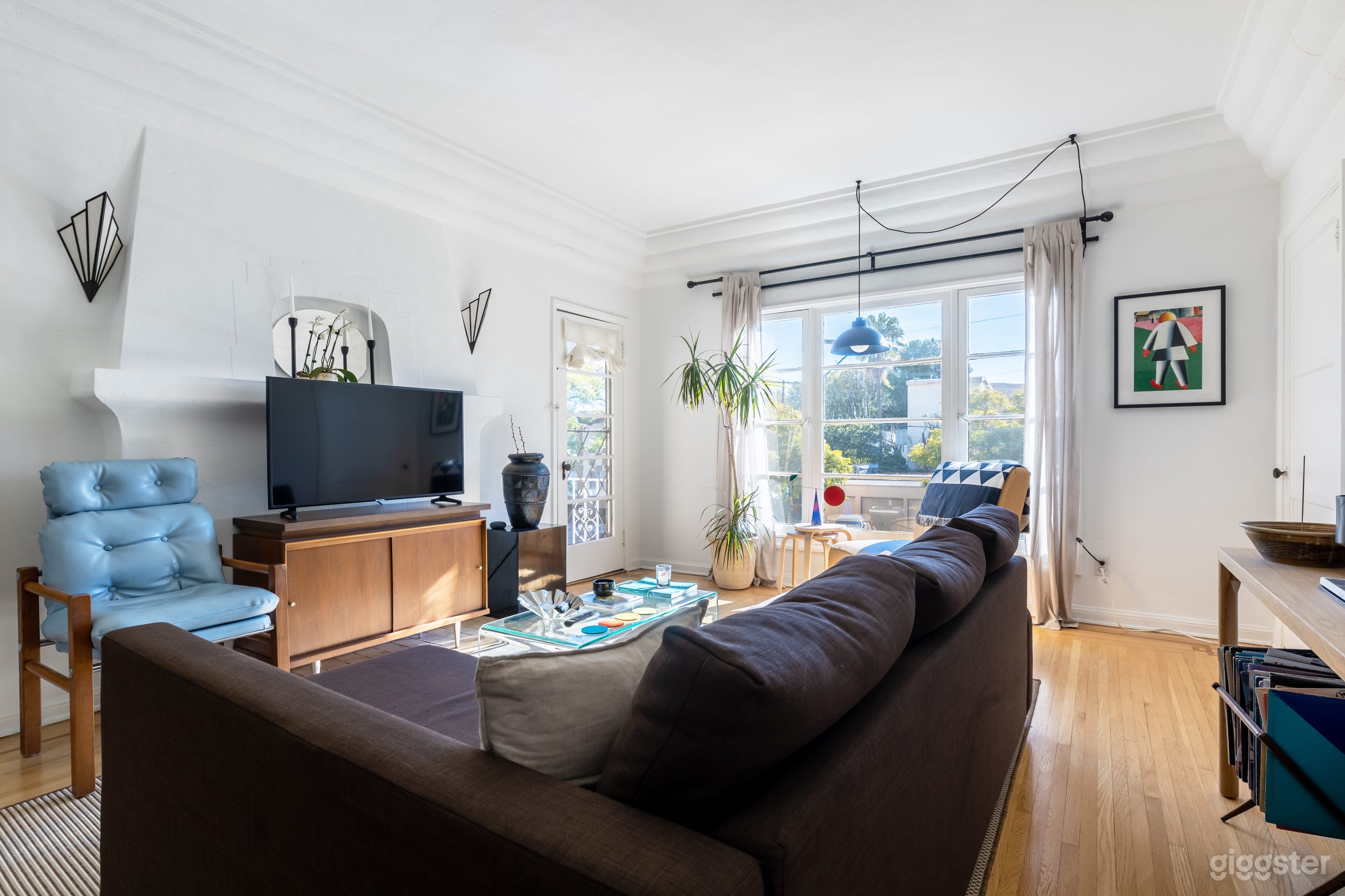 Living room with mid century modern furniture and contemporary art.