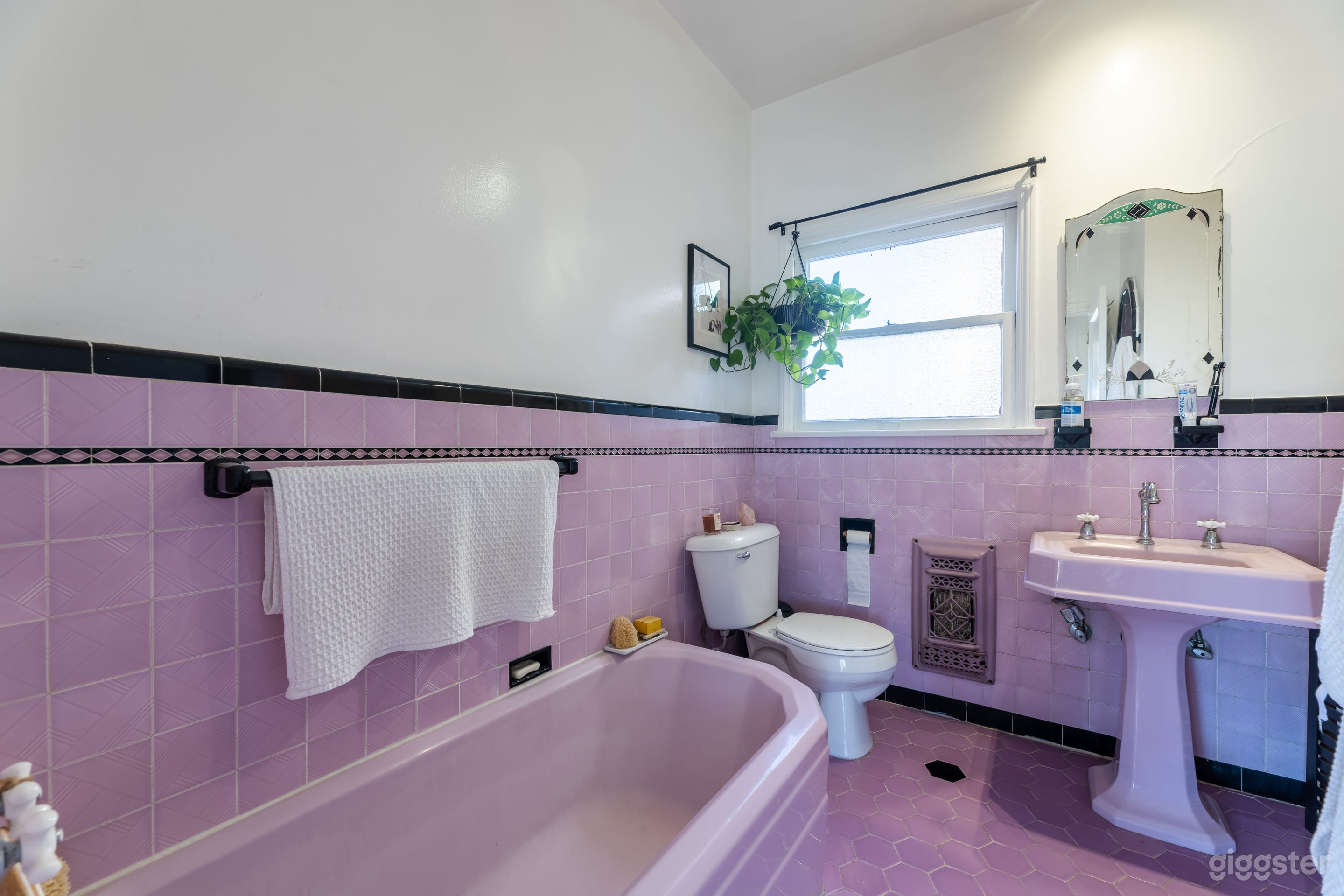 Purple tiled bathroom with separate tub and shower