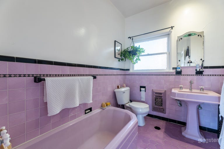  Purple tiled bathroom with separate tub and shower 