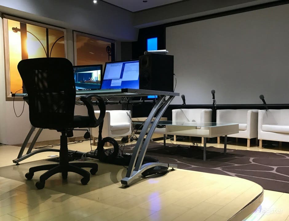 Studio A: Acoustically designed recording space. (Client chairs/sofas, High-quality microphones, Table, Large projected screen &amp; High-Quality speakers, Soundproof room)