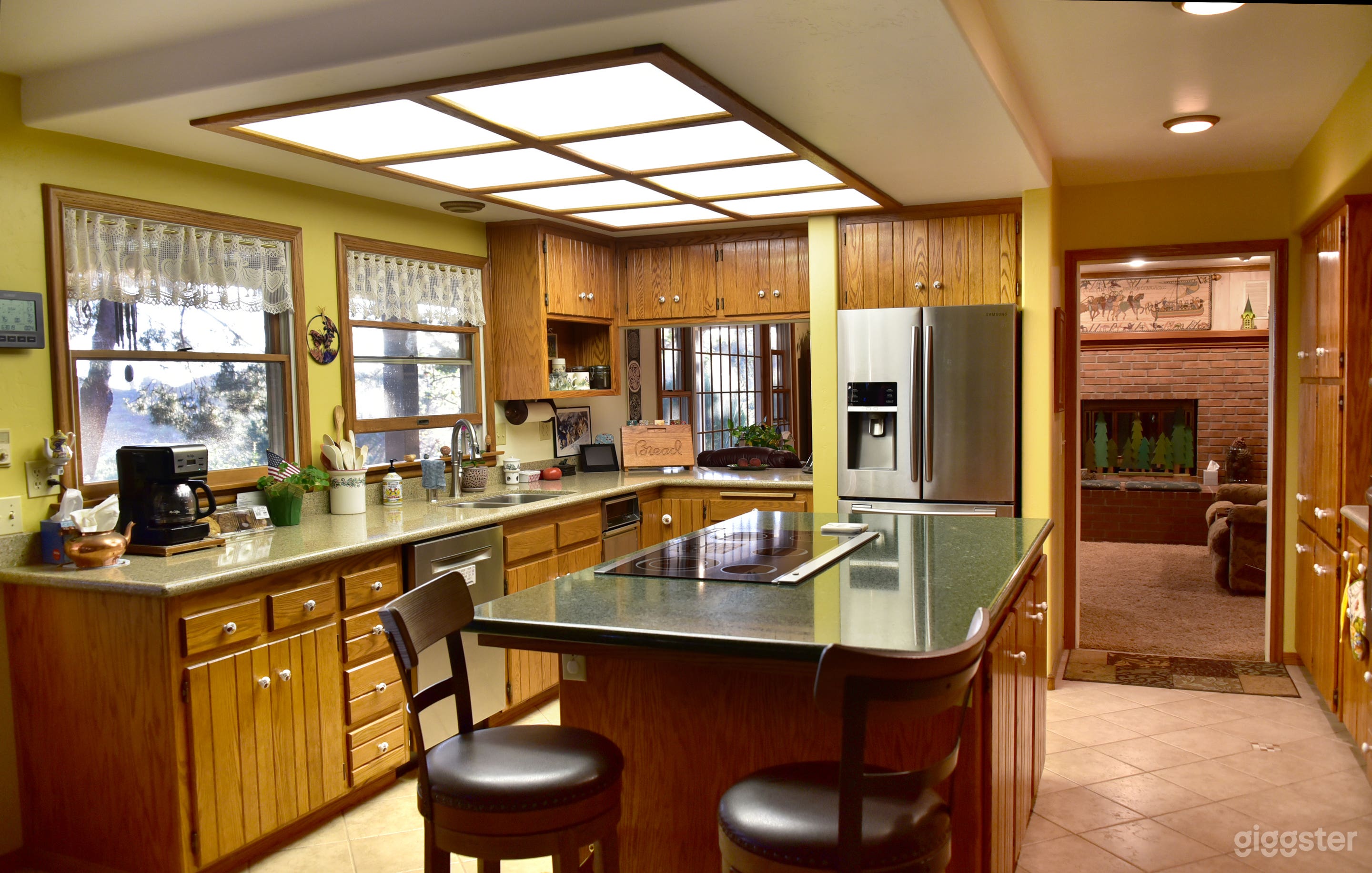 Farm kitchen and small view of family room 