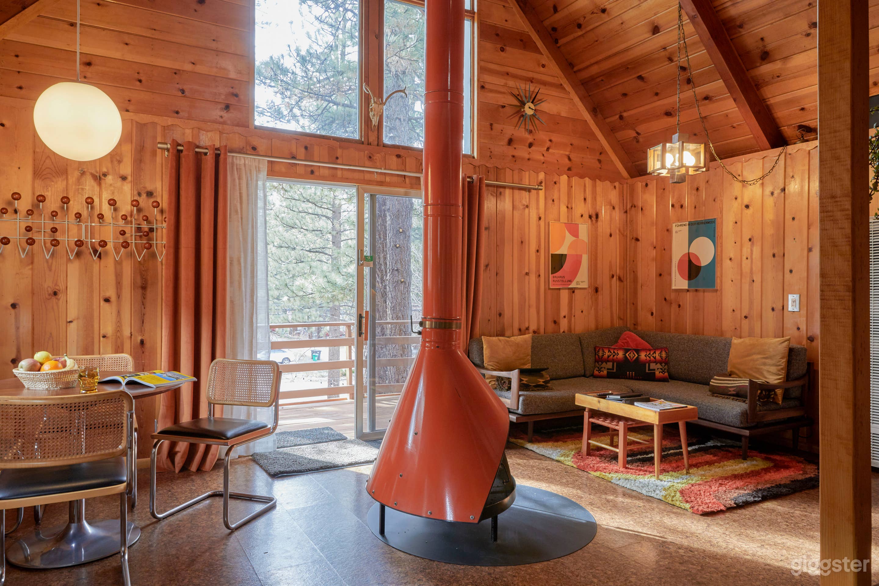 Mid Century cabin with fireplace in the middle.  Photo 1